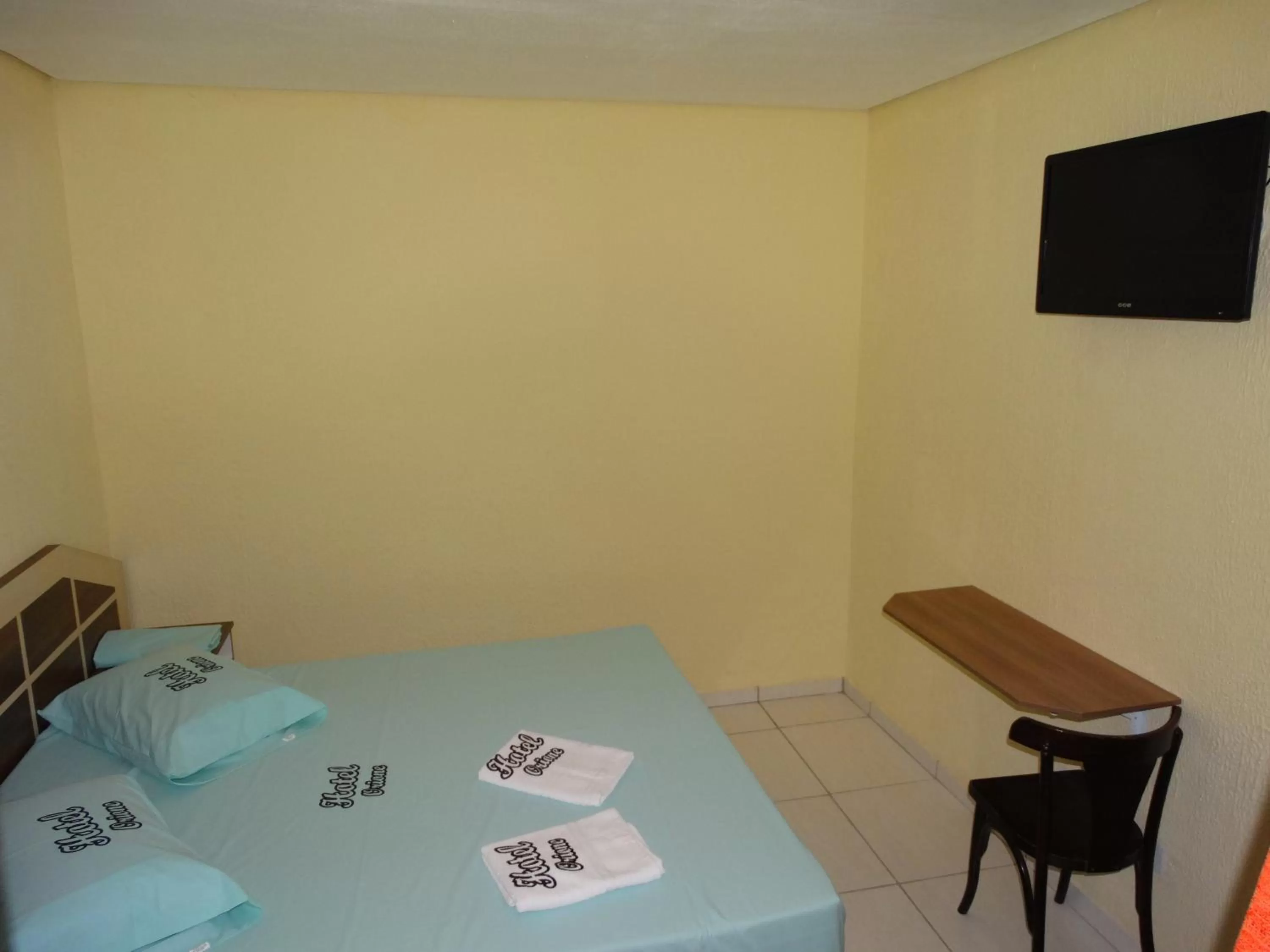 Photo of the whole room, TV/Entertainment Center in Hotel Praça Orione