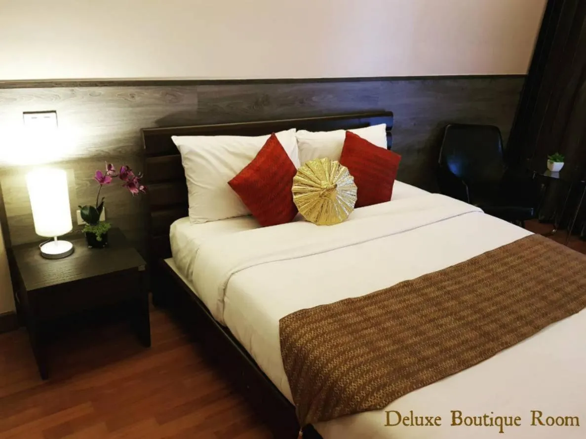 Bed in Maninarakorn Hotel