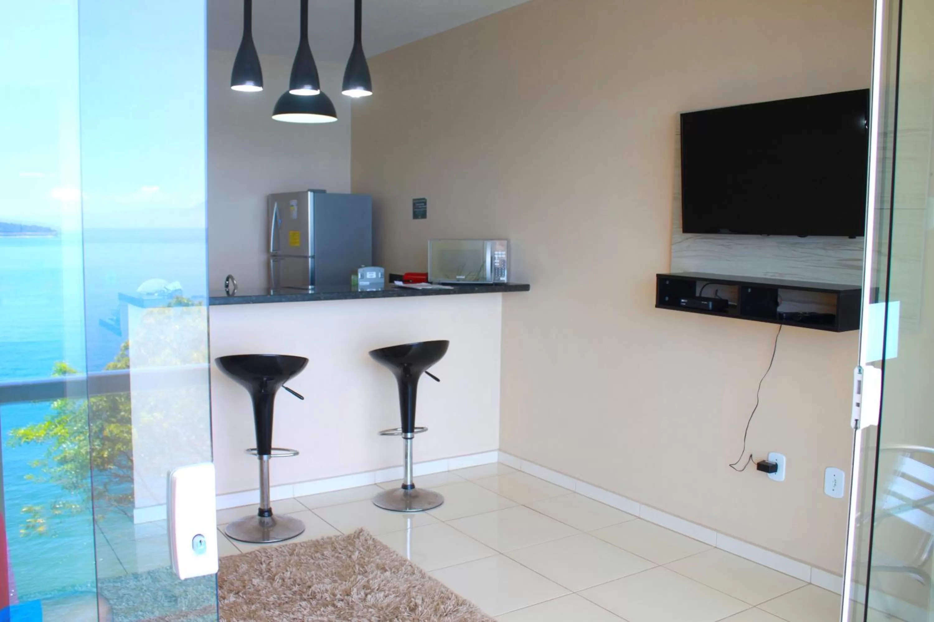 Photo of the whole room, TV/Entertainment Center in Ocean Green Flats