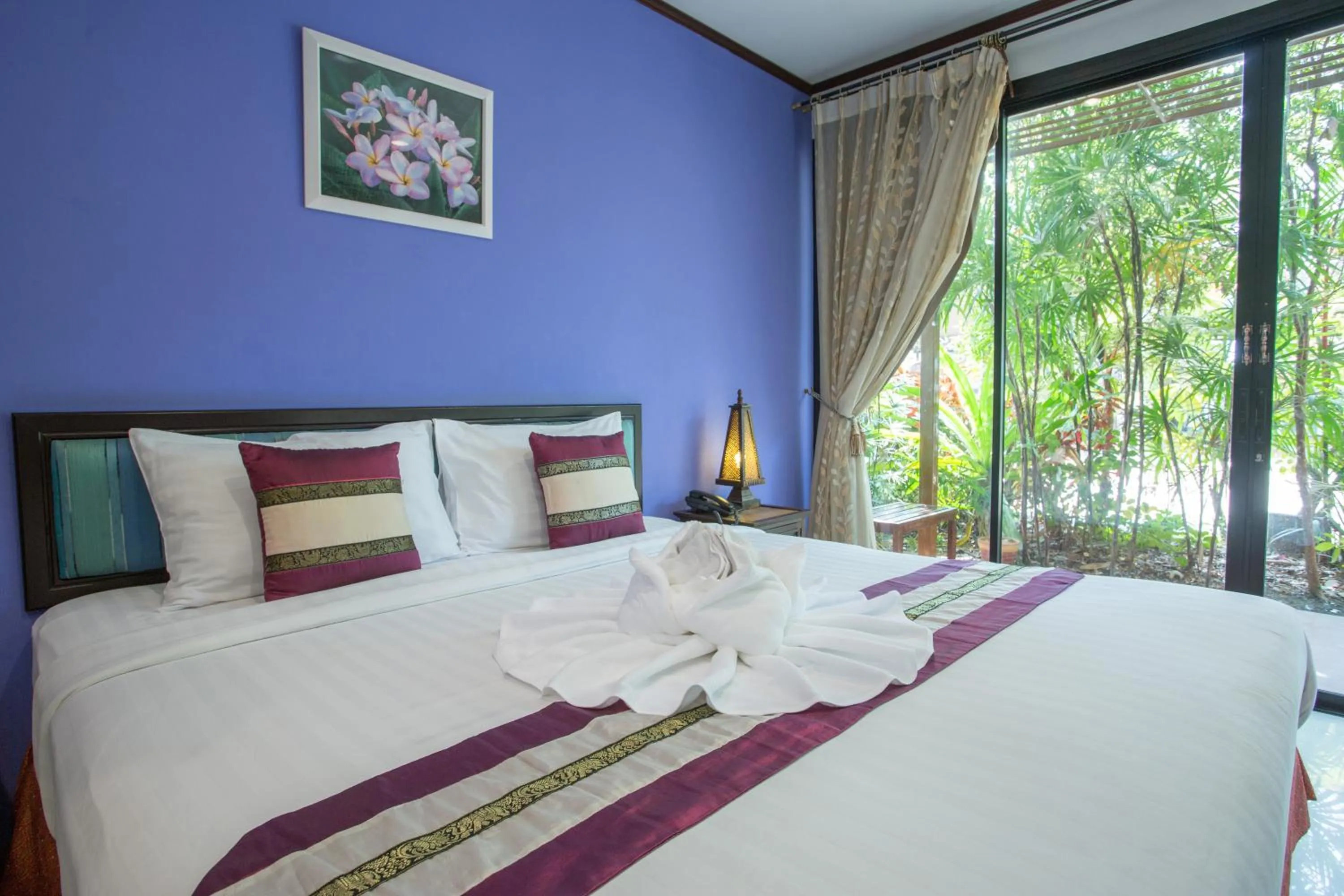 Bed in PloyKhumThong Boutique Resort
