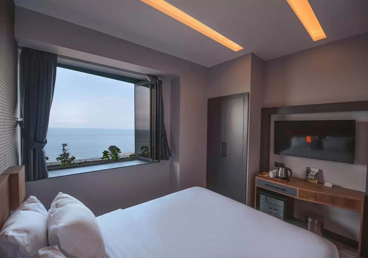 Bed in Peerless Villas Hotel