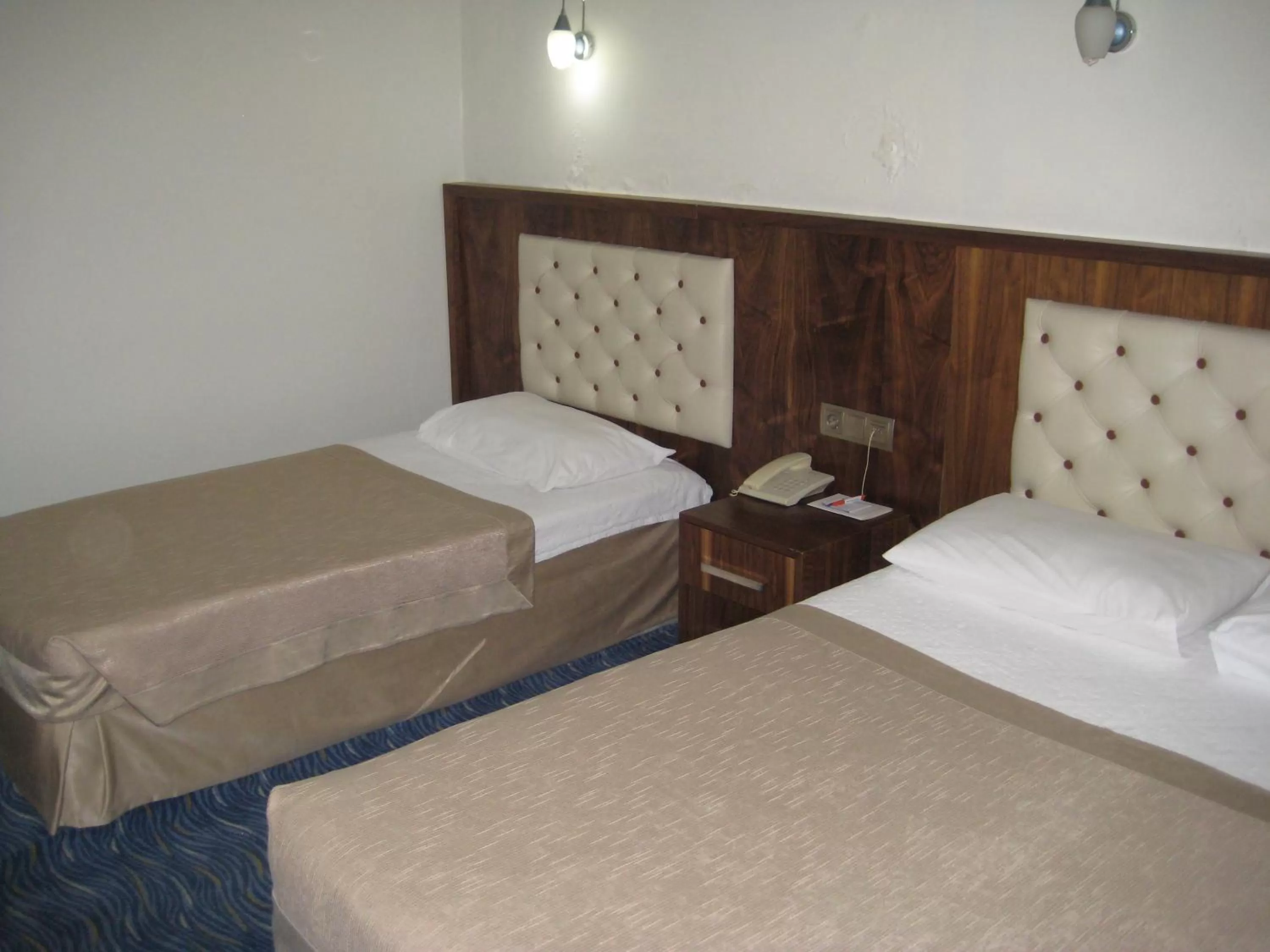 Bed, Room Photo in Miroglu Hotel