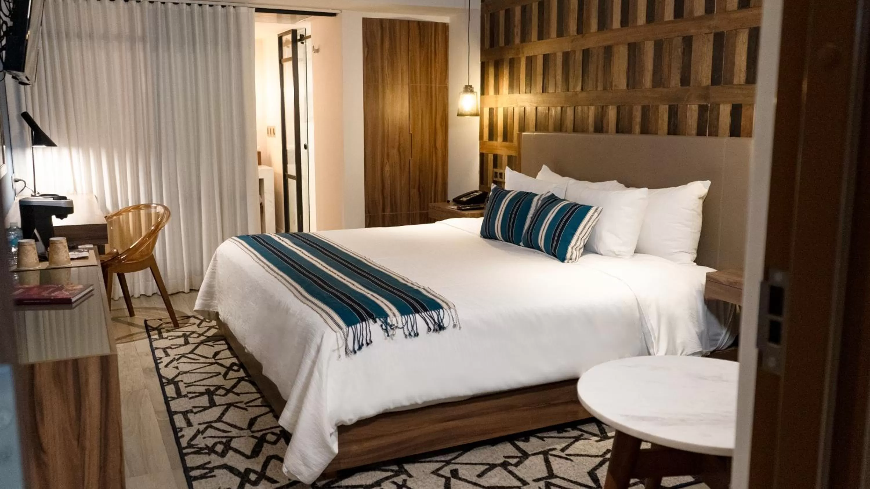 Bed in Hotel Indigo Guadalajara Expo by IHG