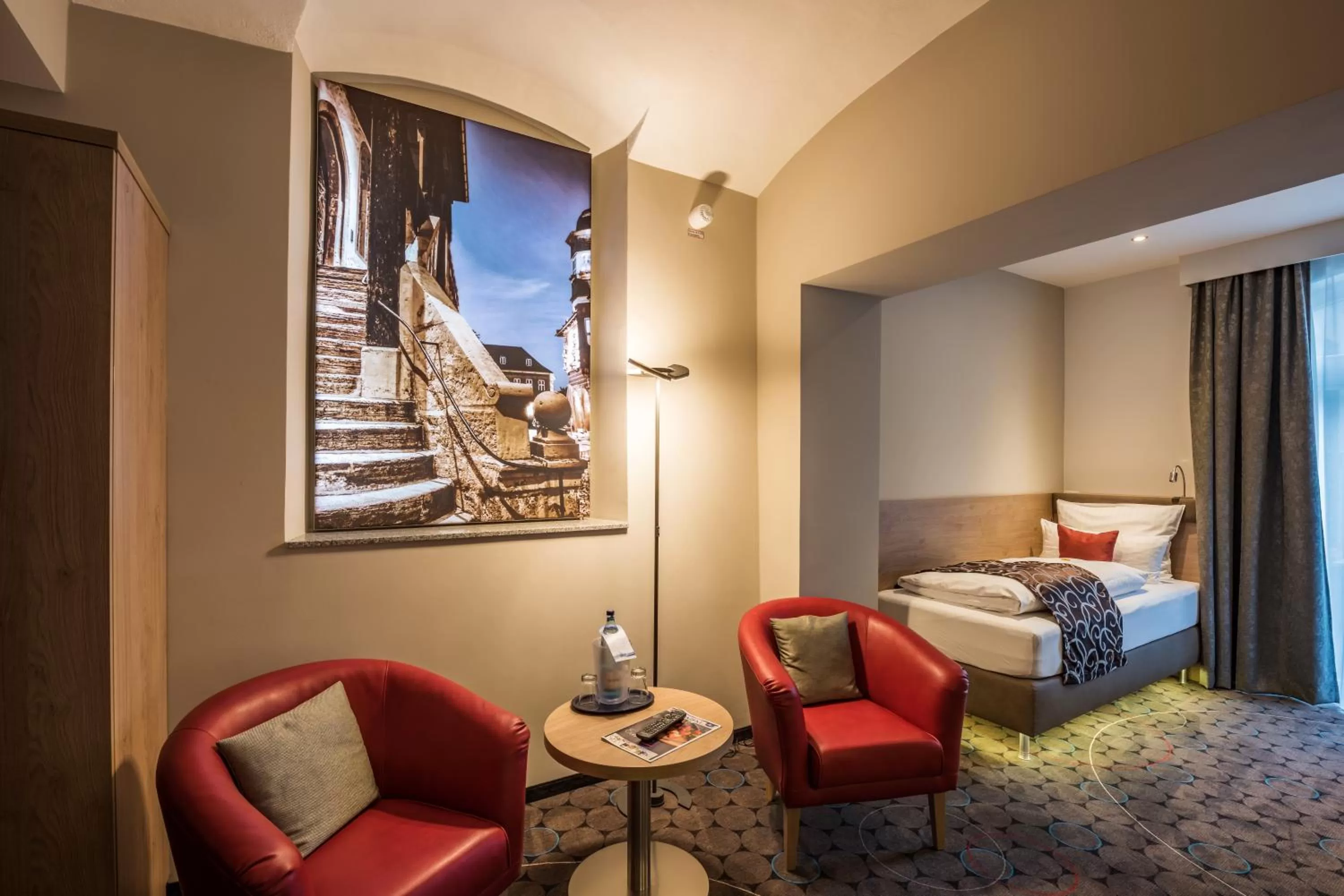 Living room, Bed in AKZENT Hotel Villa Saxer