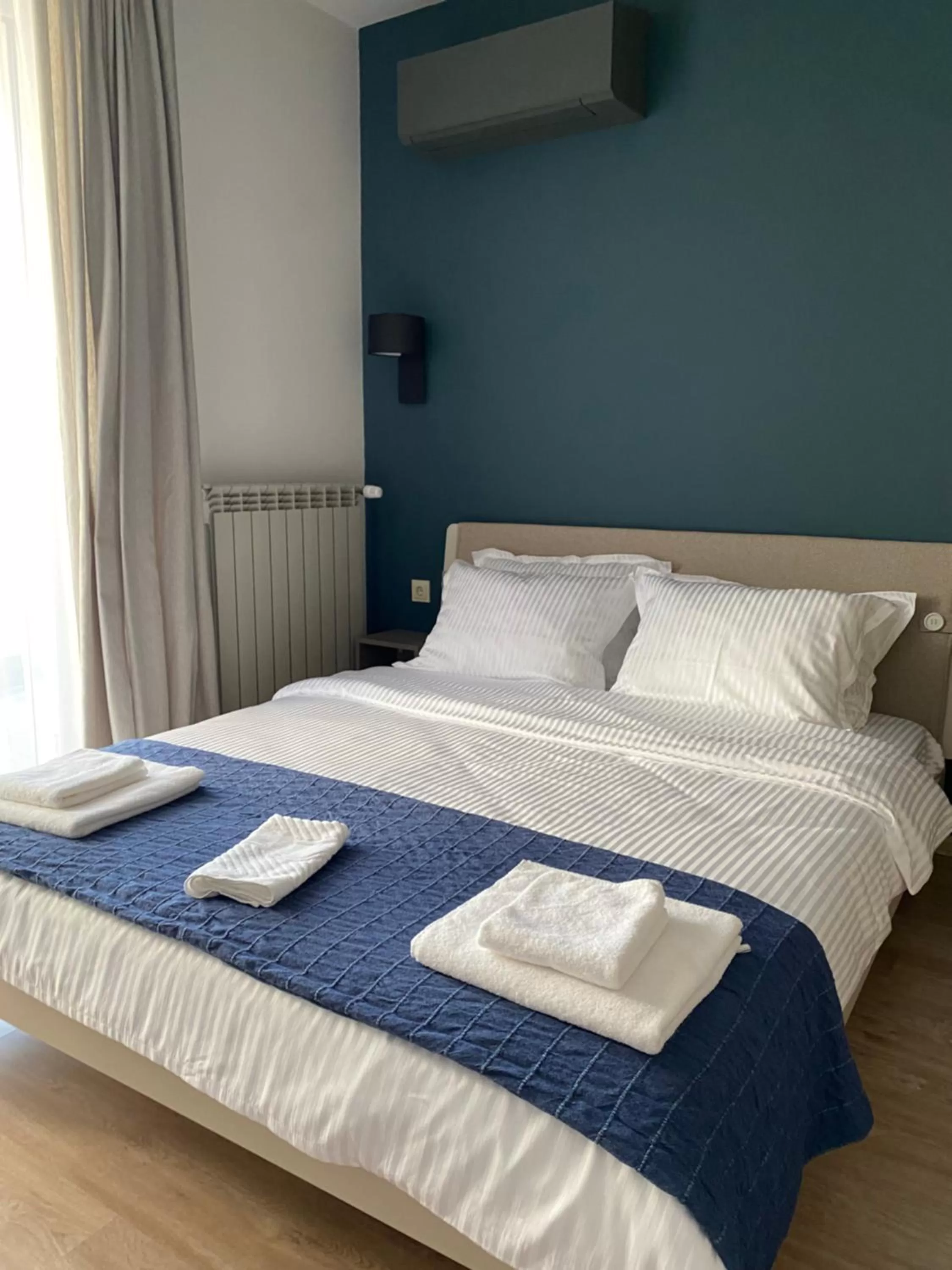 Bed in 7th Sense boutique apartments