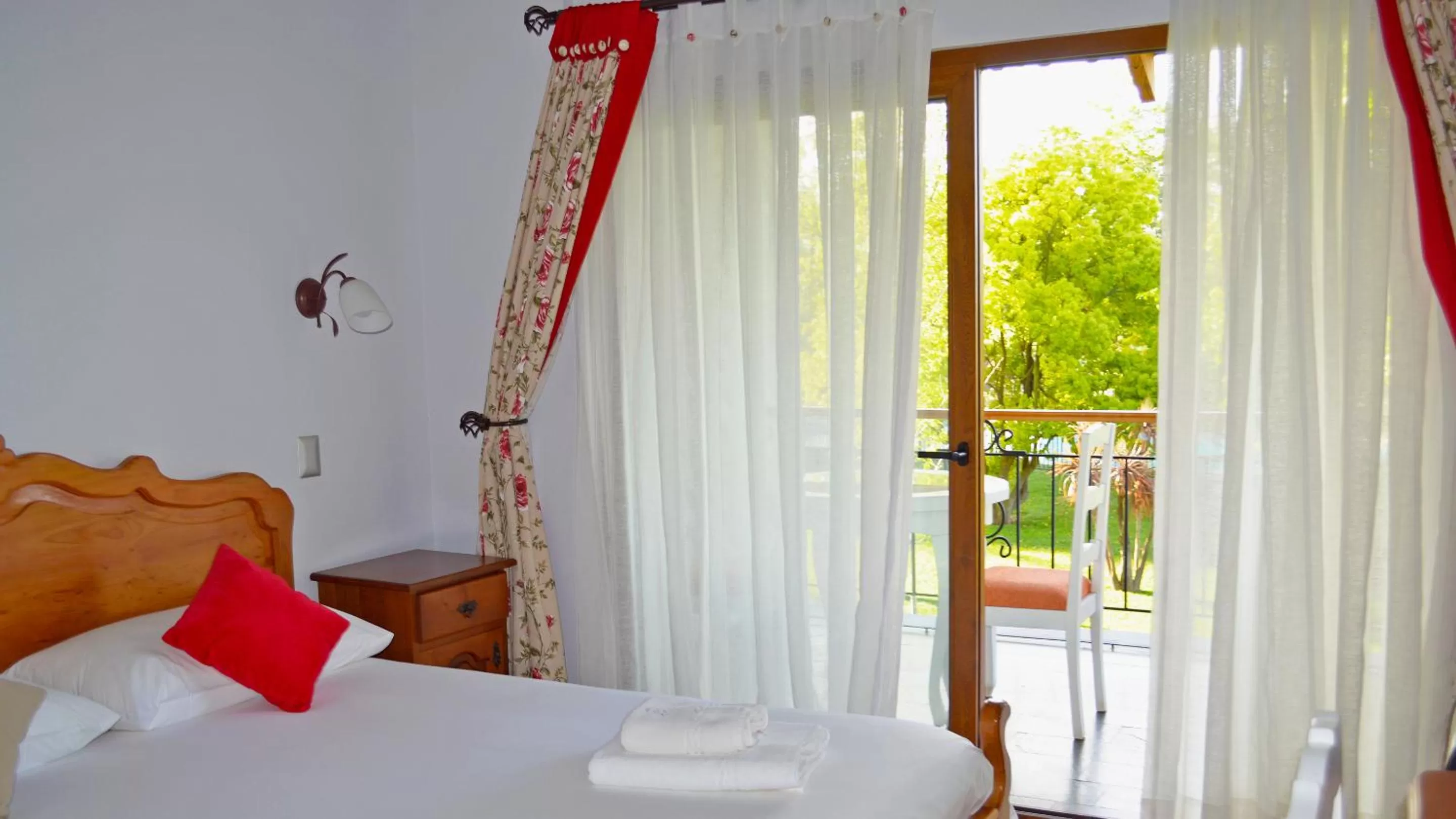 Bed in La Perla Hotel