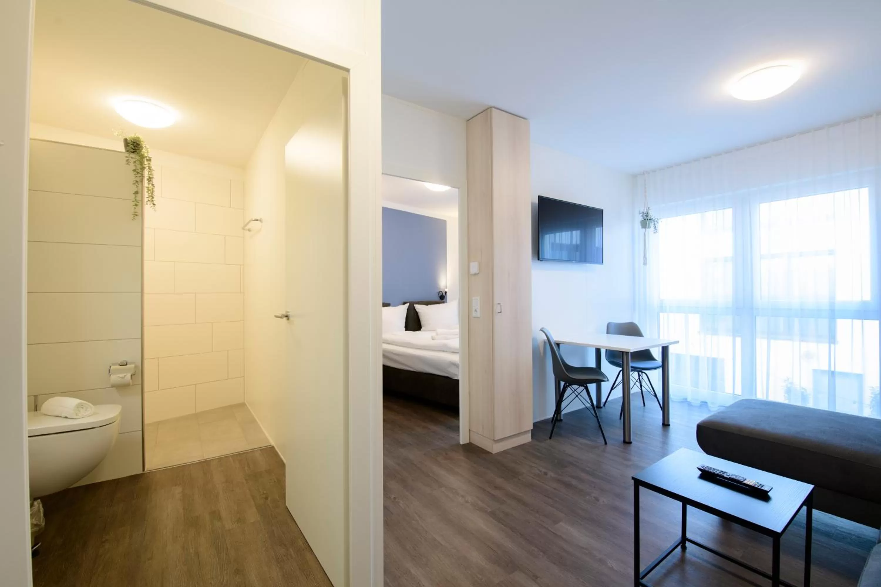 Living room, Bed in Smart & Stay Aparthotel Saarbrücken Süd - Self-Check-In - Free Parking