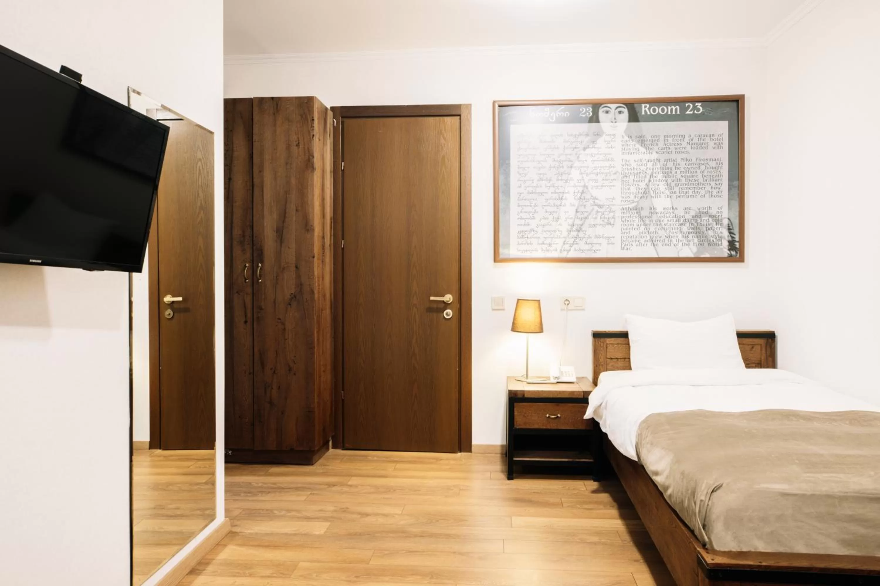 Communal lounge/ TV room, Bed in Citadel Narikala Hotel