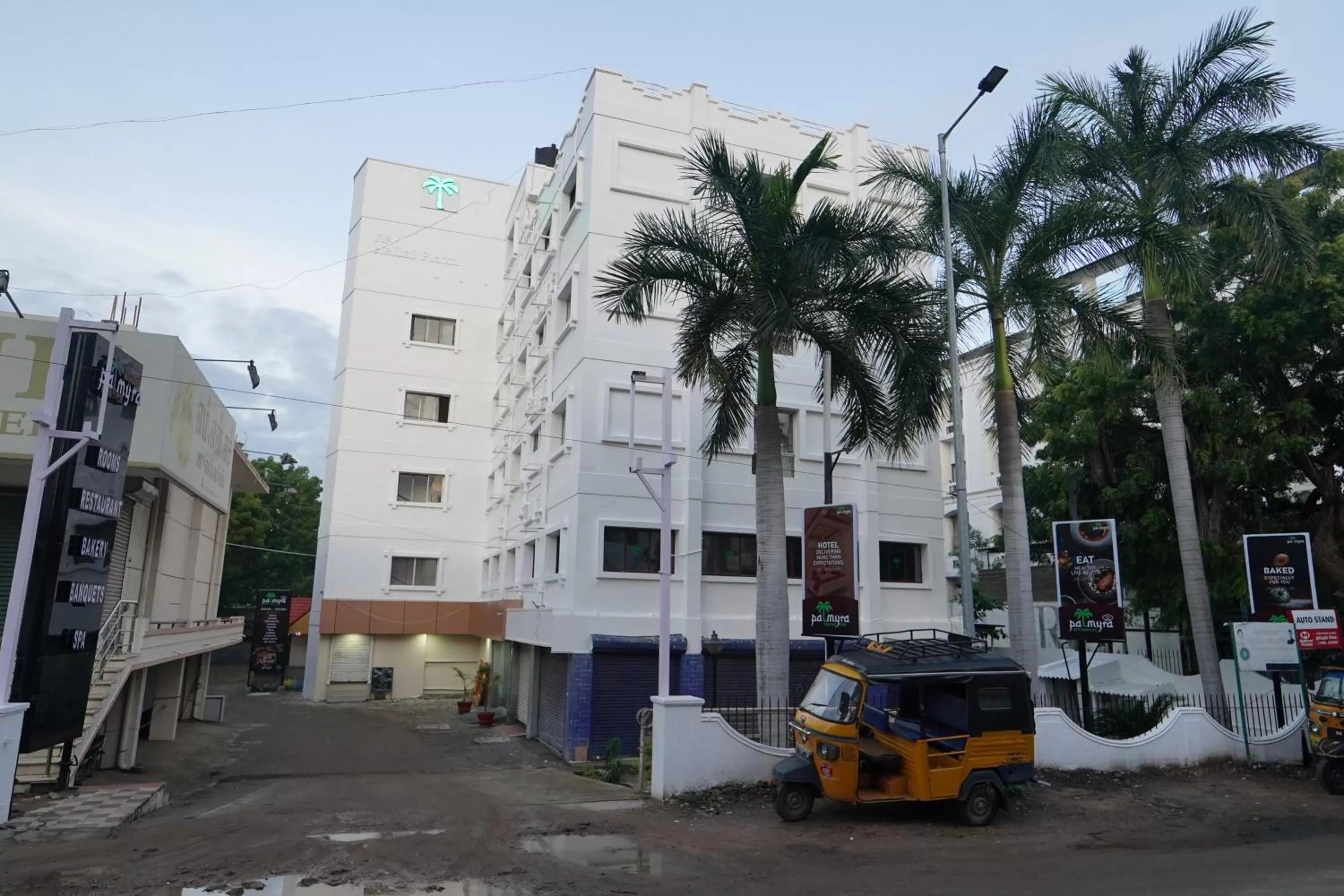 Property building in Hotel Palmyra Grand Inn