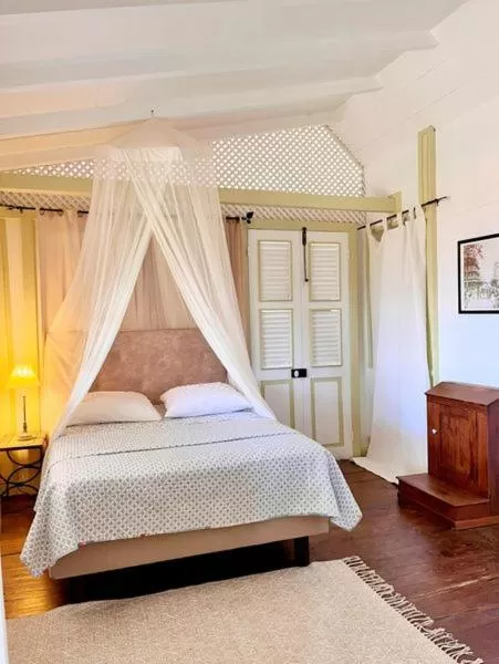 Bed in Habitation La Reine du Camp Chambres d'Hôtes