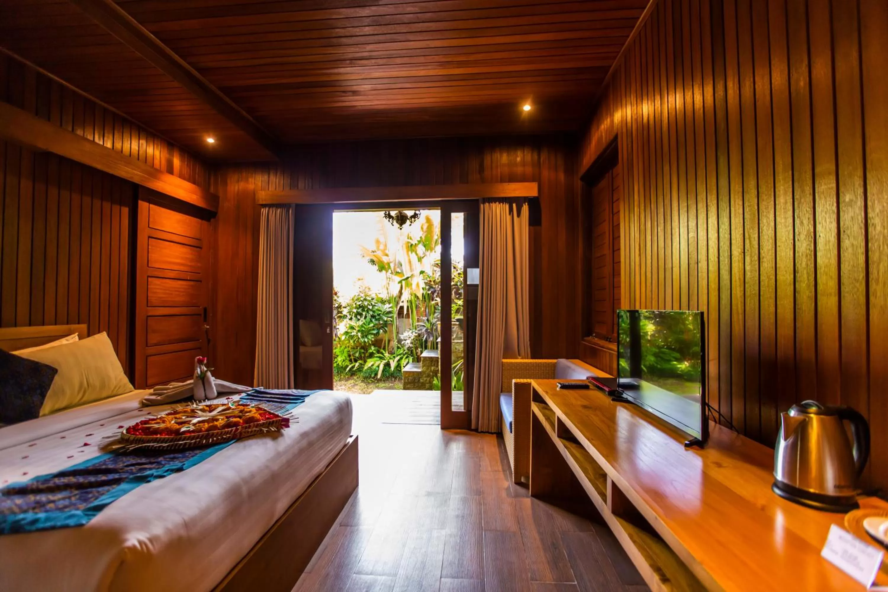 Bed in Seken Cottages Ubud