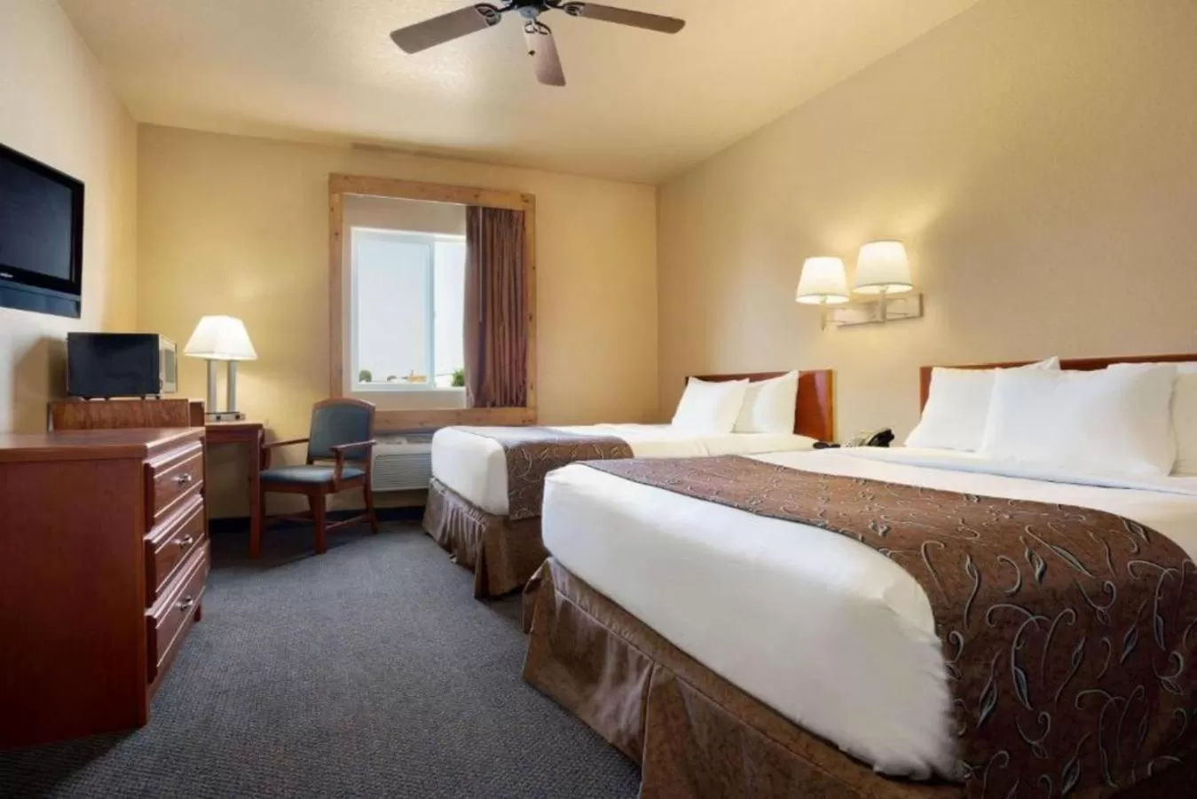 Queen Room with Two Queen Beds - Non-Smoking in Travelodge by Wyndham Gillette