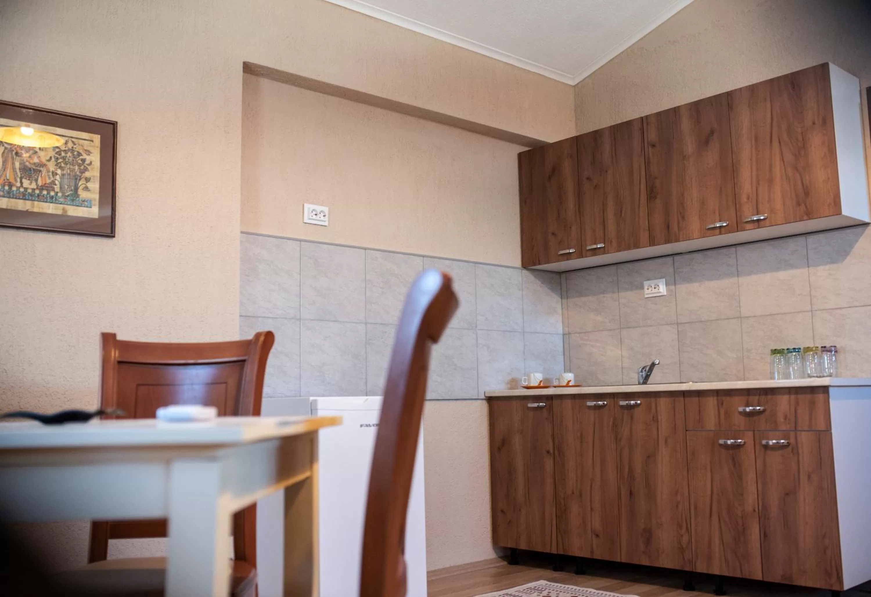 Kitchen/Kitchenette in DIONIS Rooms & Apartments