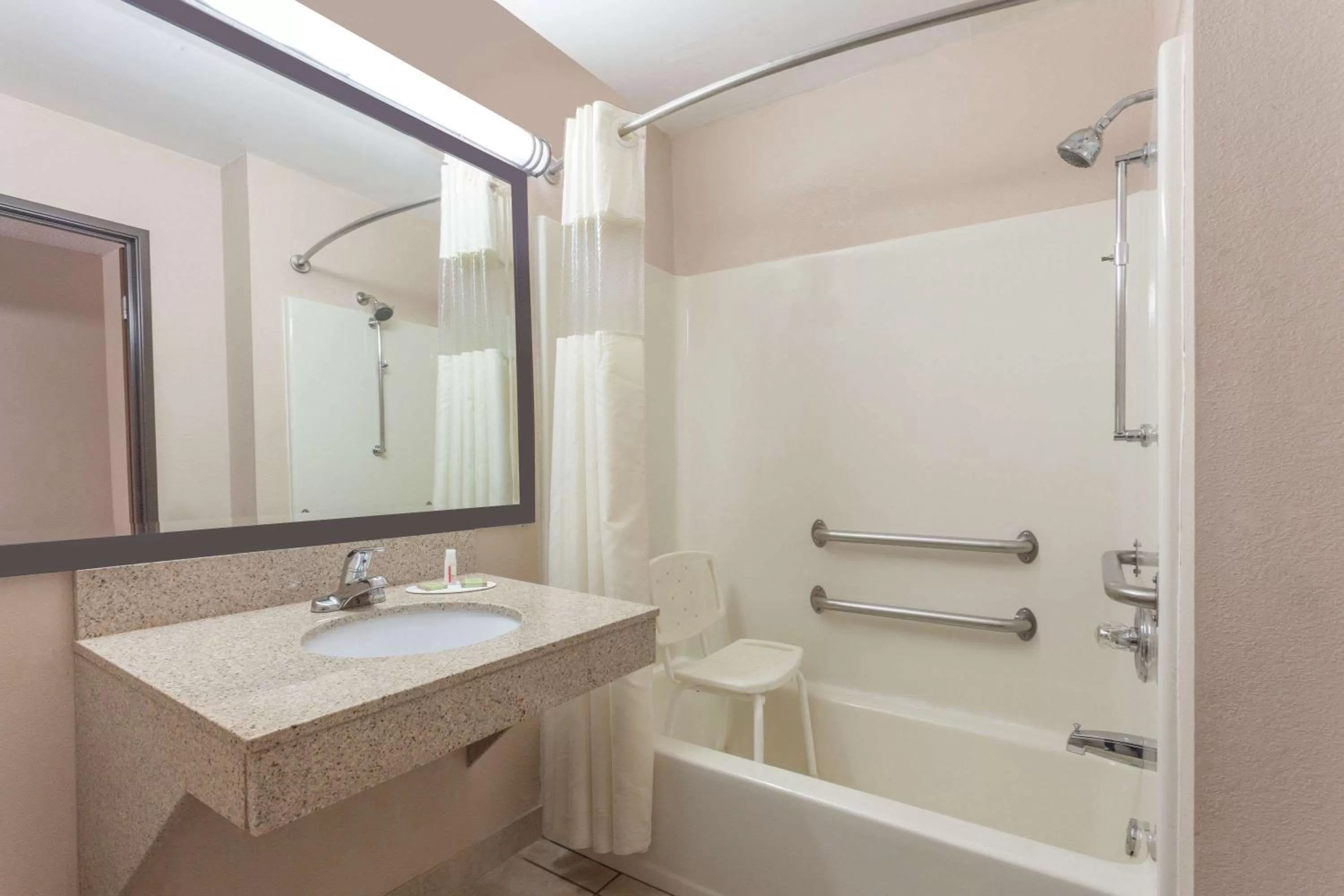 Bathroom in Super 8 by Wyndham Carrollton