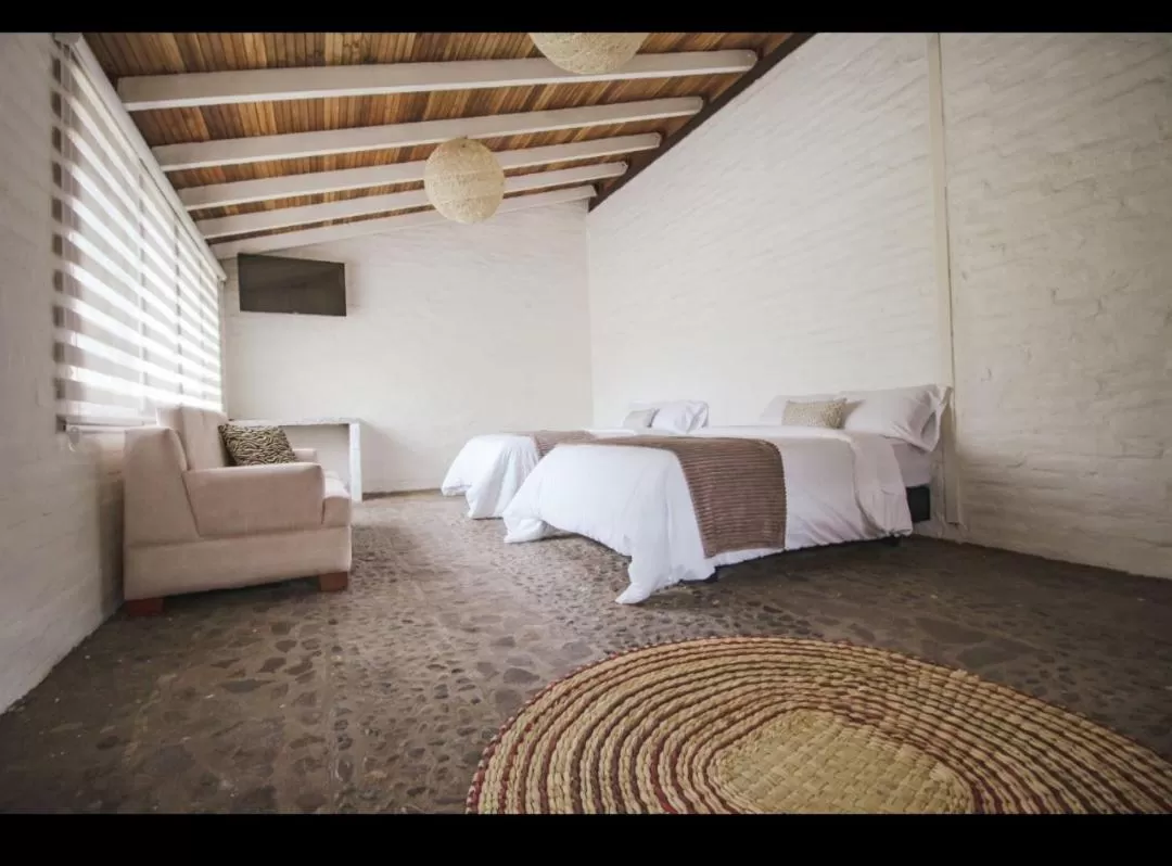 Bed in Rústic Hotel Quinta La Aurora