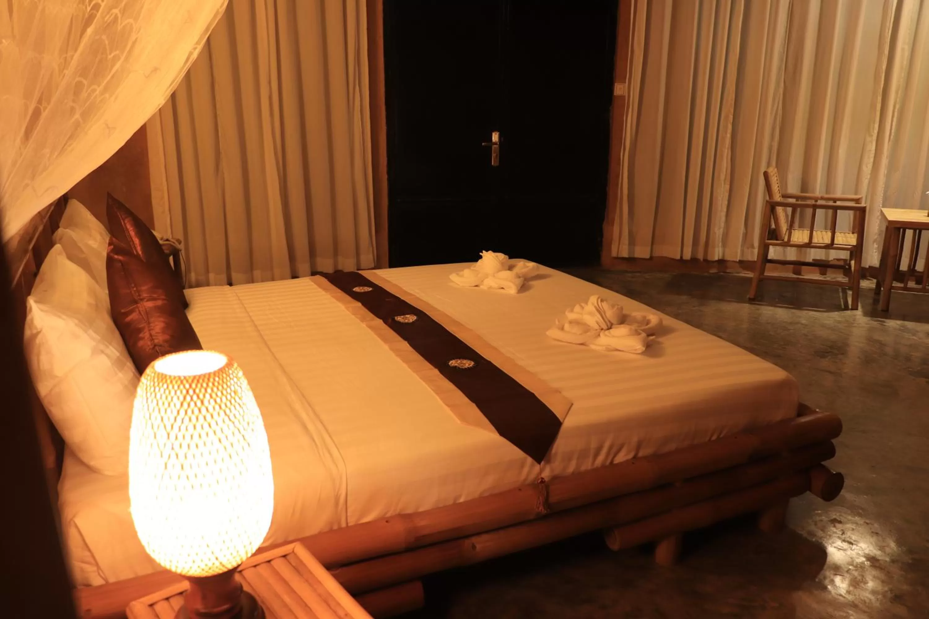 Bed in Hanchey Bamboo Resort