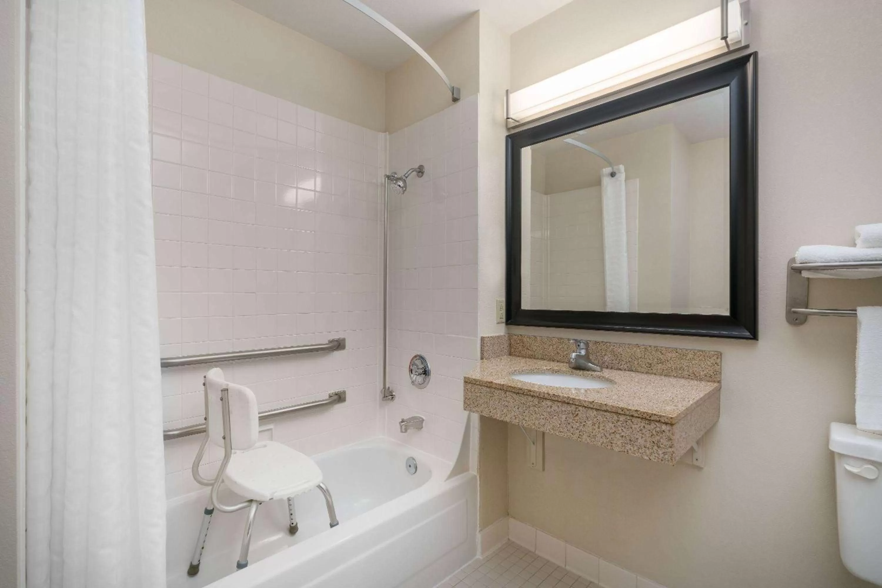 Bathroom in AmericInn by Wyndham Johnston Des Moines