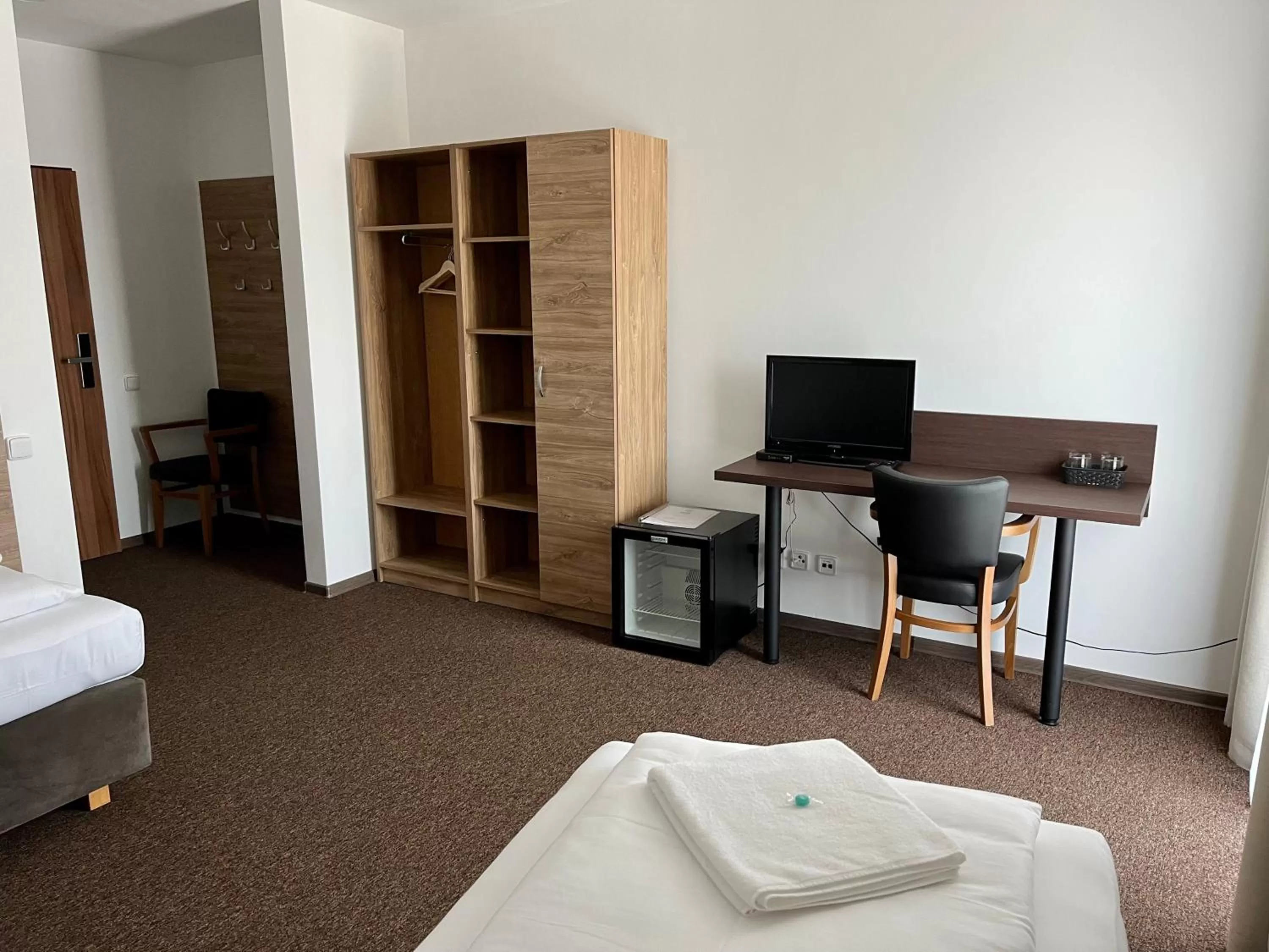 Bed, TV/Entertainment Center in Hotel Sport Mlada Boleslav