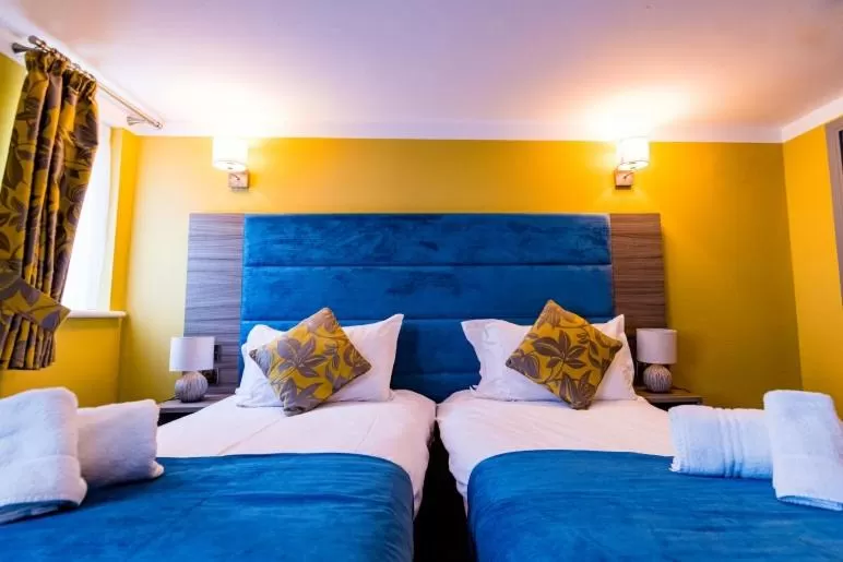 Bed in Stonecross Manor Hotel