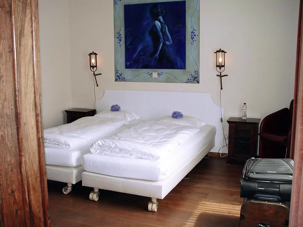 Bed in Hotel Huys van Heusden