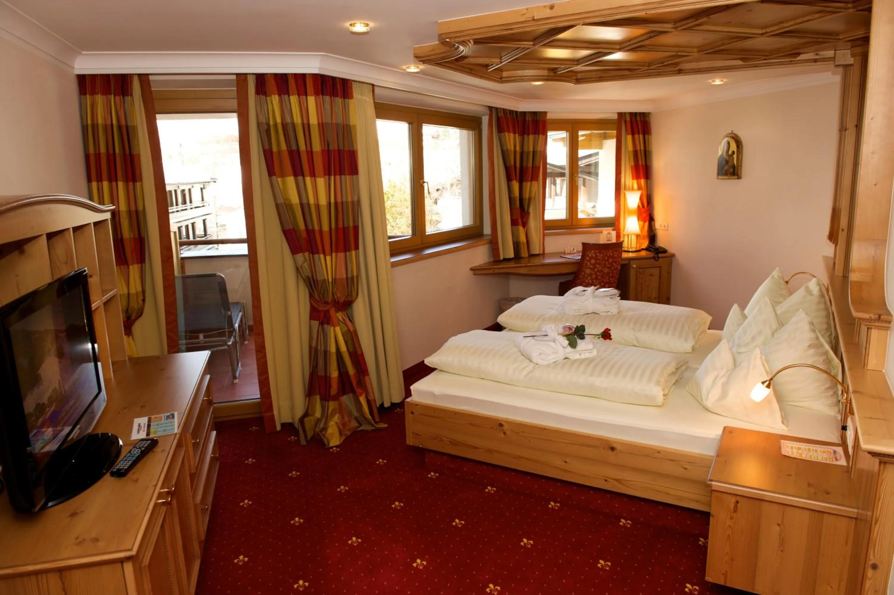 Photo of the whole room, Bed in JUFA Alpenhotel Saalbach