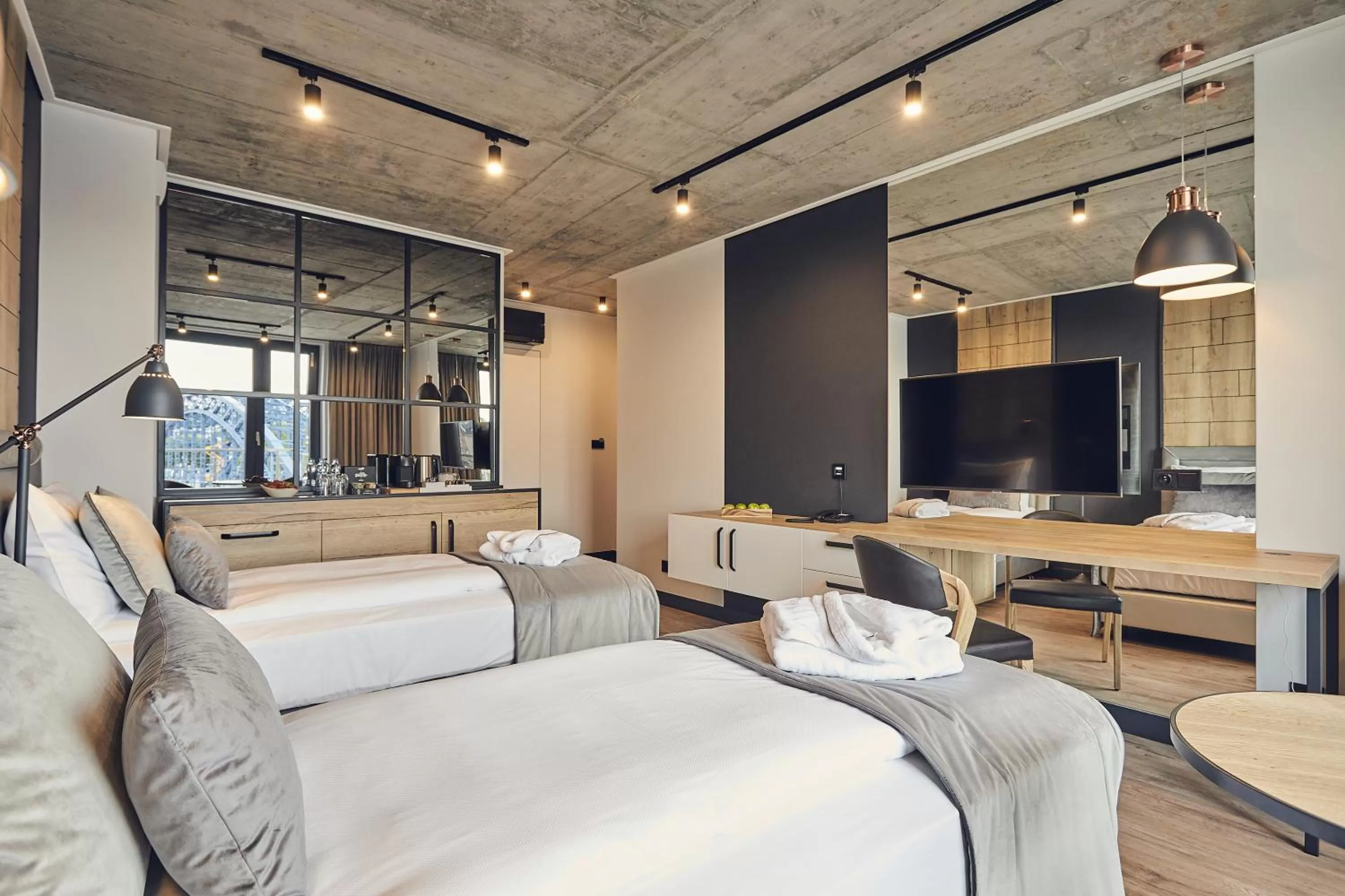 Bed in The Bridge Suites Hotel