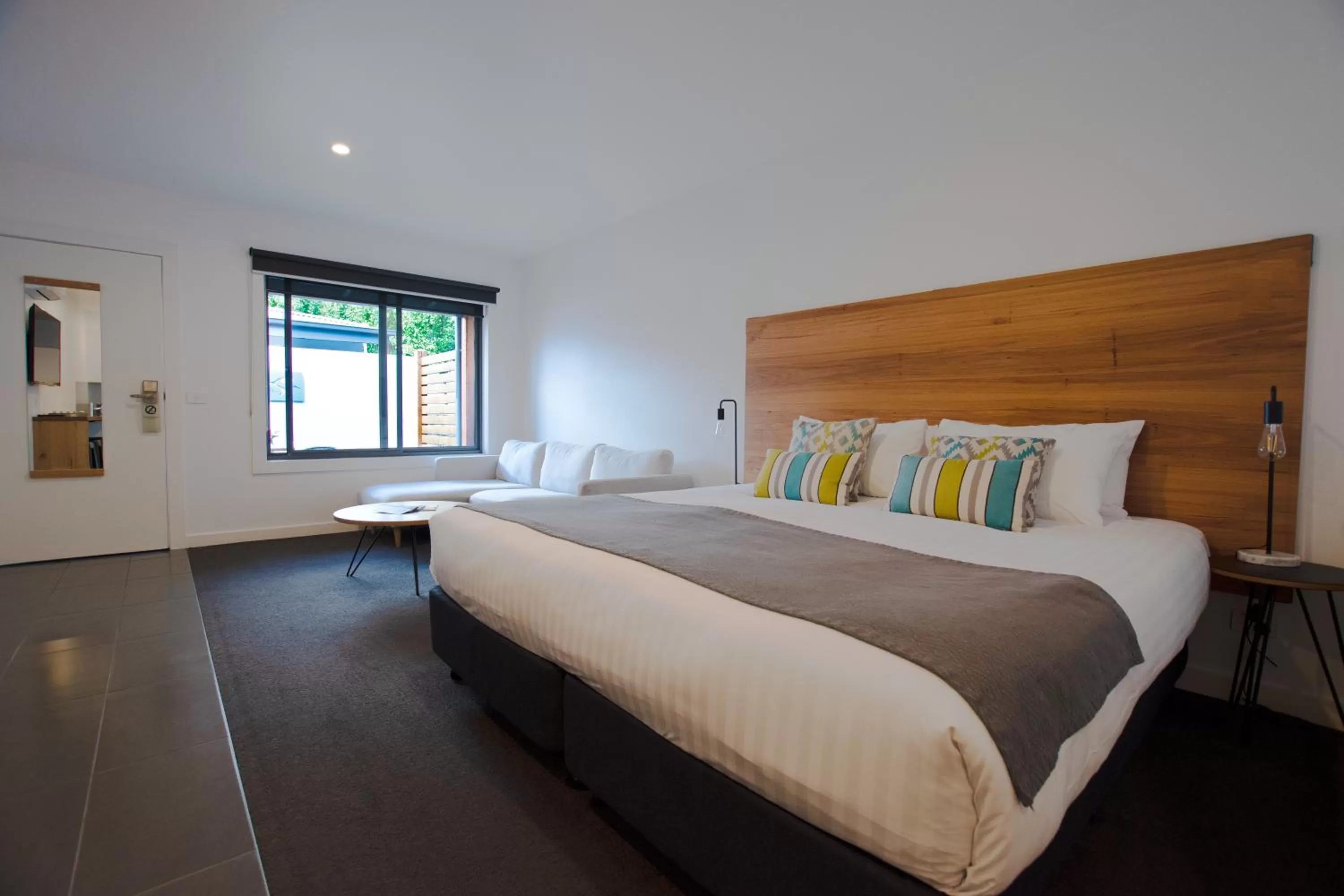 Bed in Bright Colonial Motel