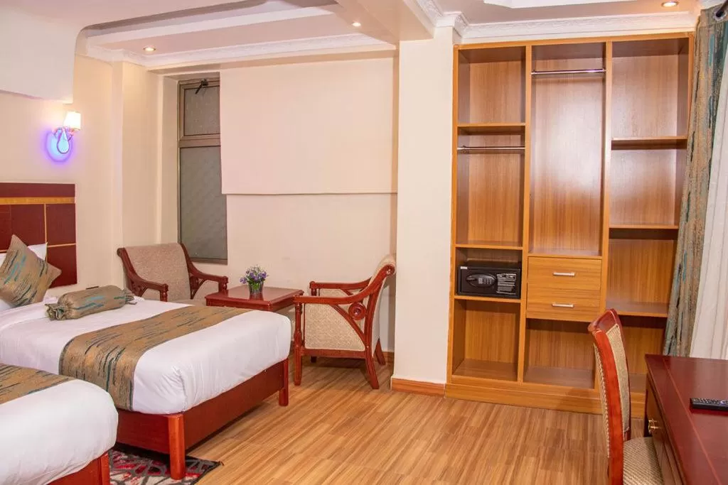 Seating area, Bed in Vickmark Hotel