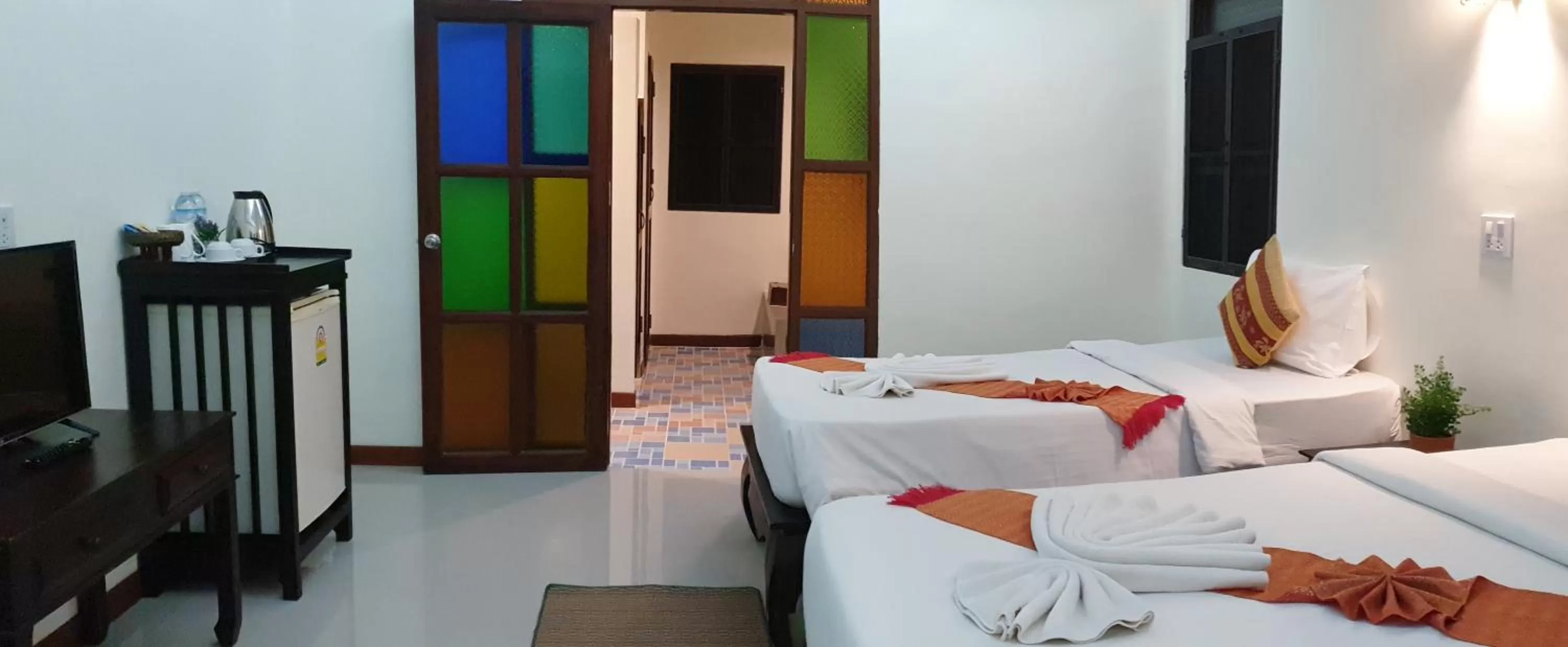 Bed in Rainforest Huahin Village Hotel