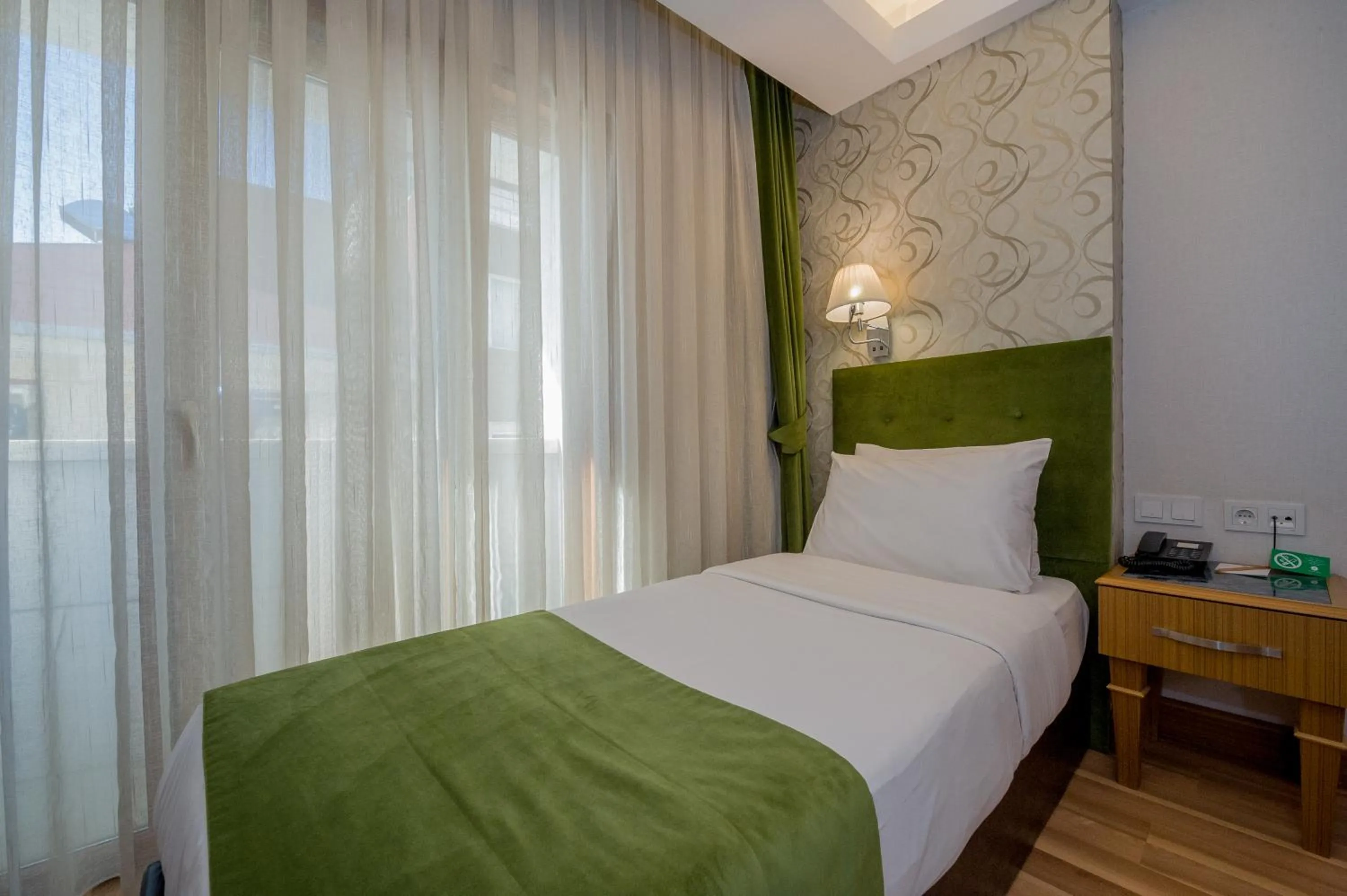 Bed in Bizim Hotel