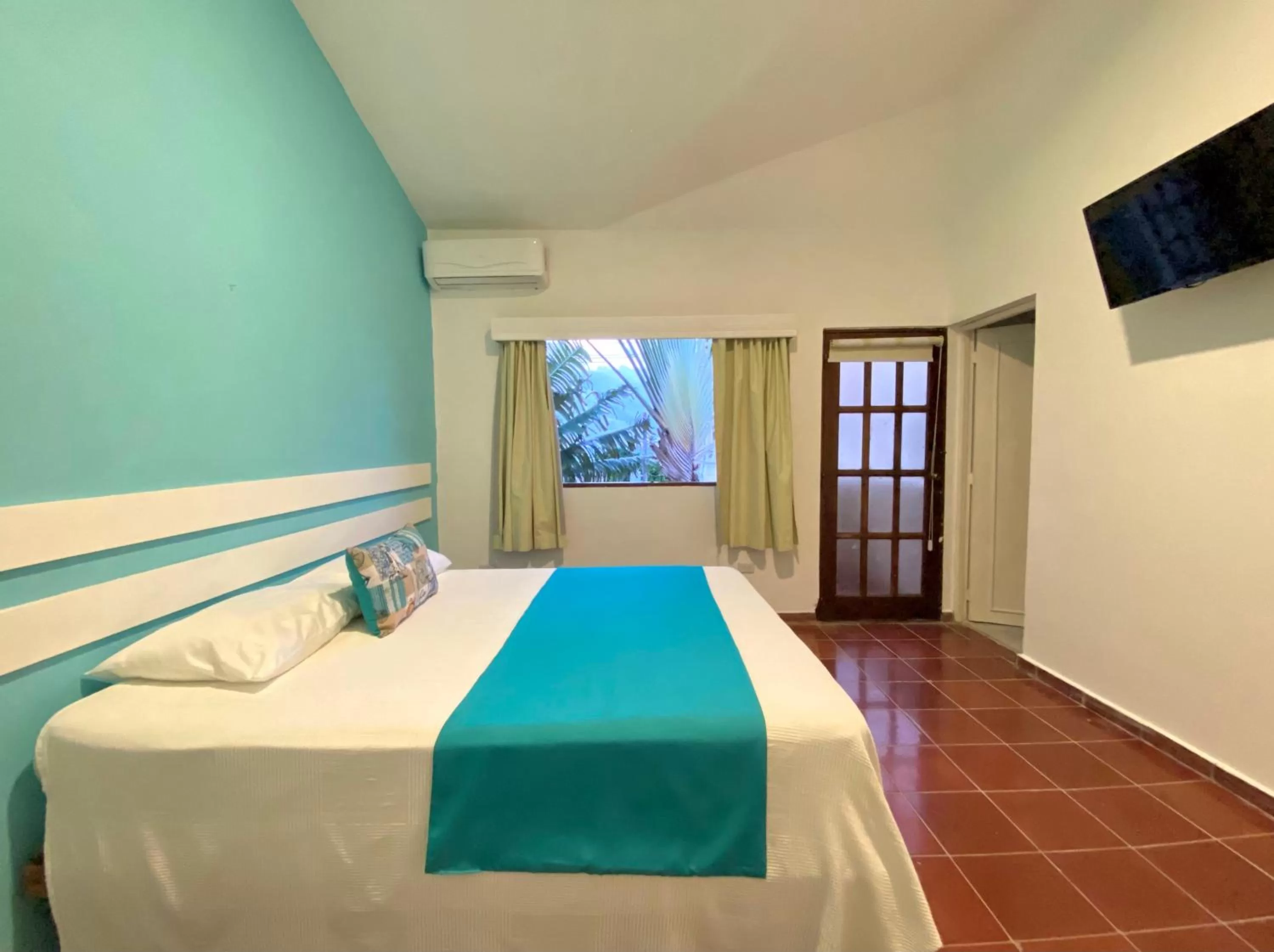 Bed in Calypso Beach Hotel by The Urbn House Santo Domingo Airport