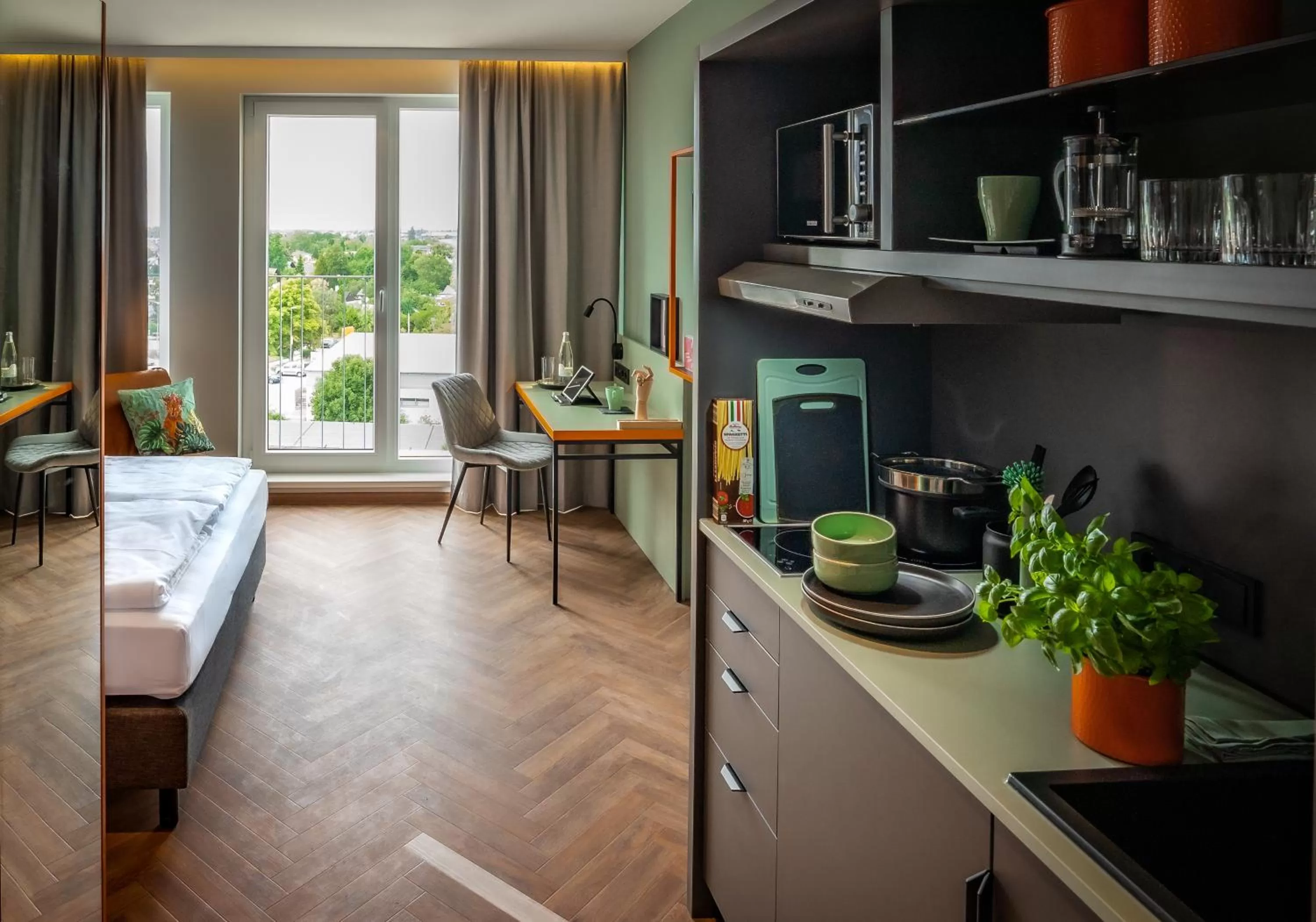 Kitchen or kitchenette in LOGINN Hotel Berlin Airport