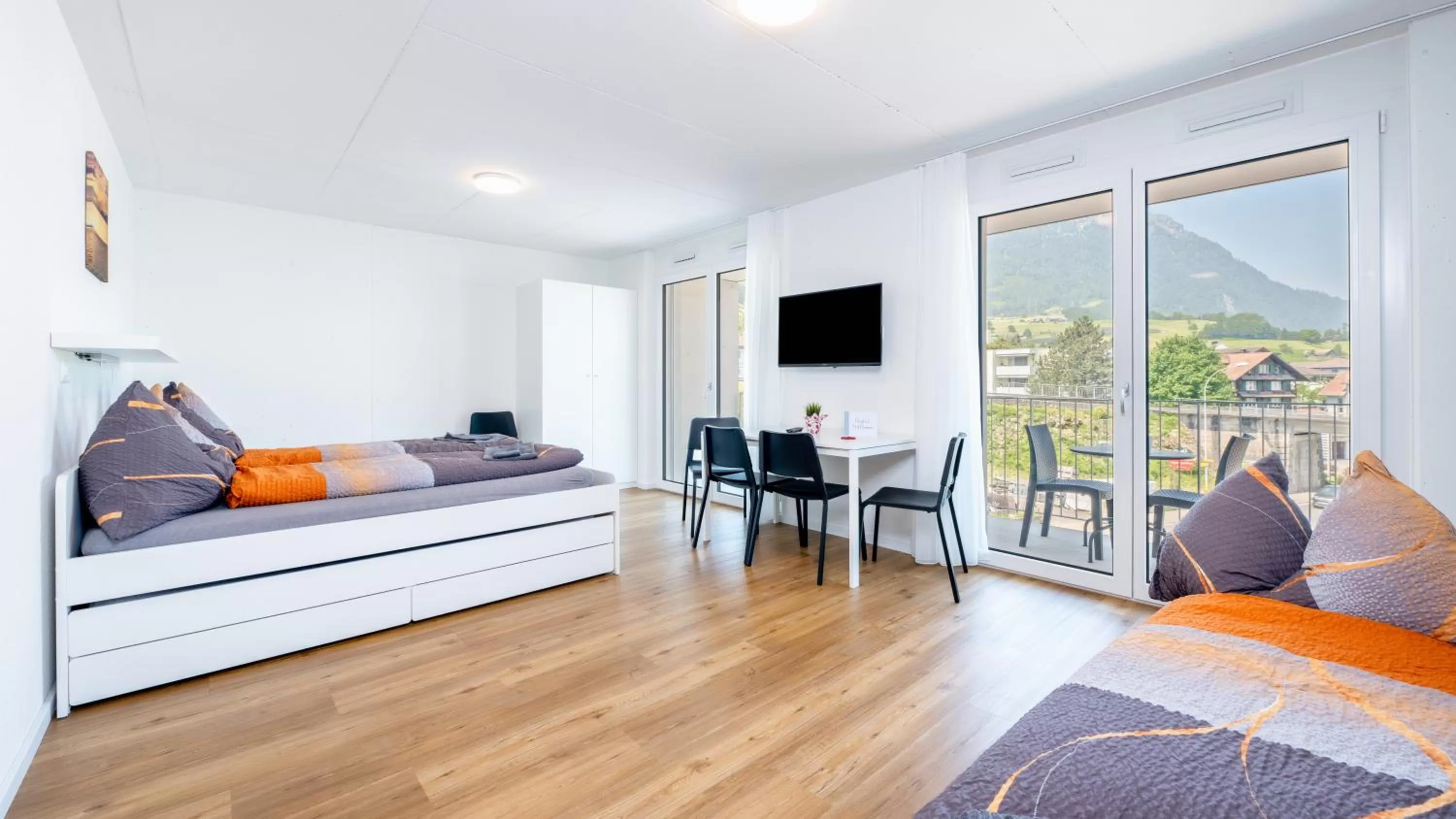 Balcony/Terrace, Bed in Anstatthotel Goldau - self-check-in