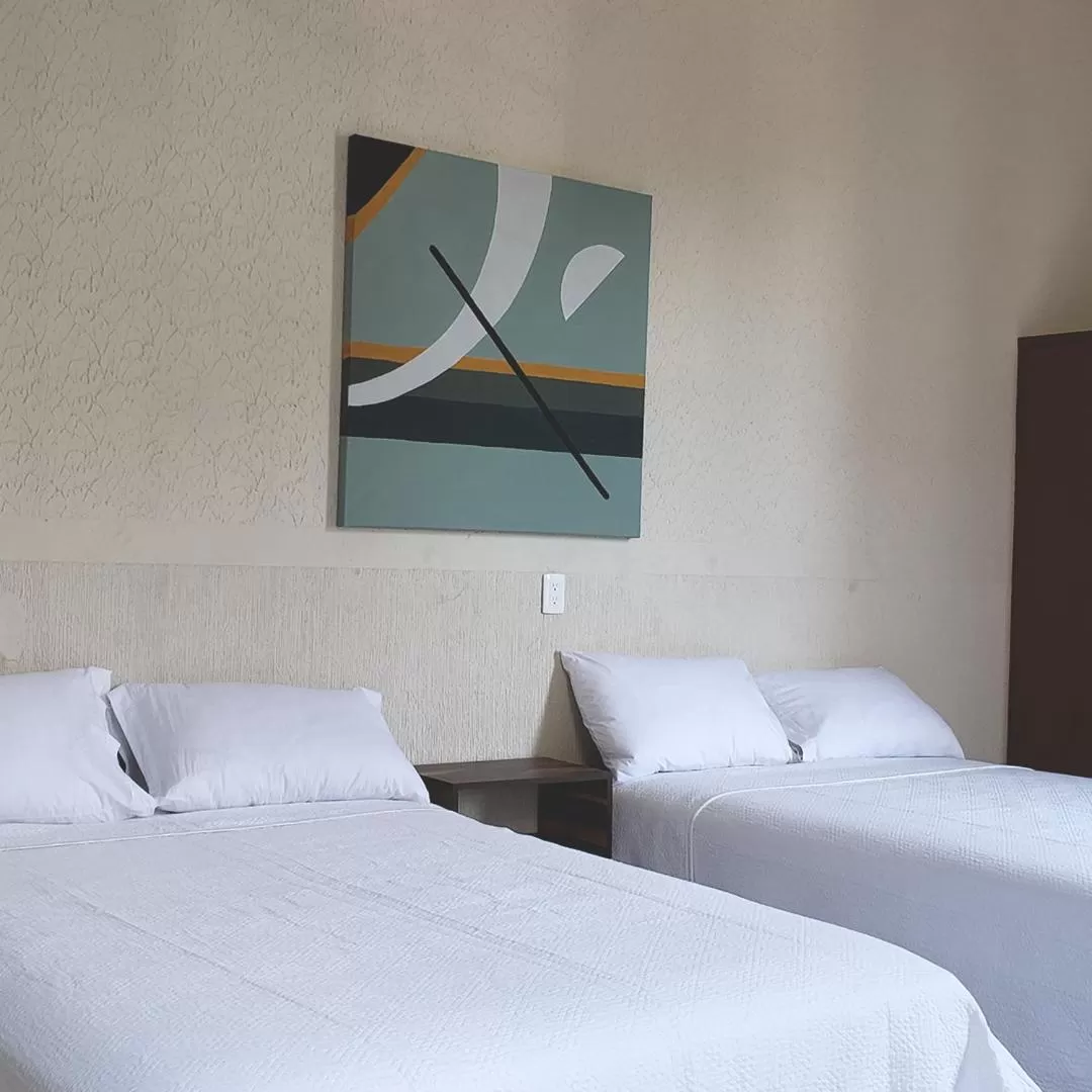 Bed in Hotel Grand Isitia