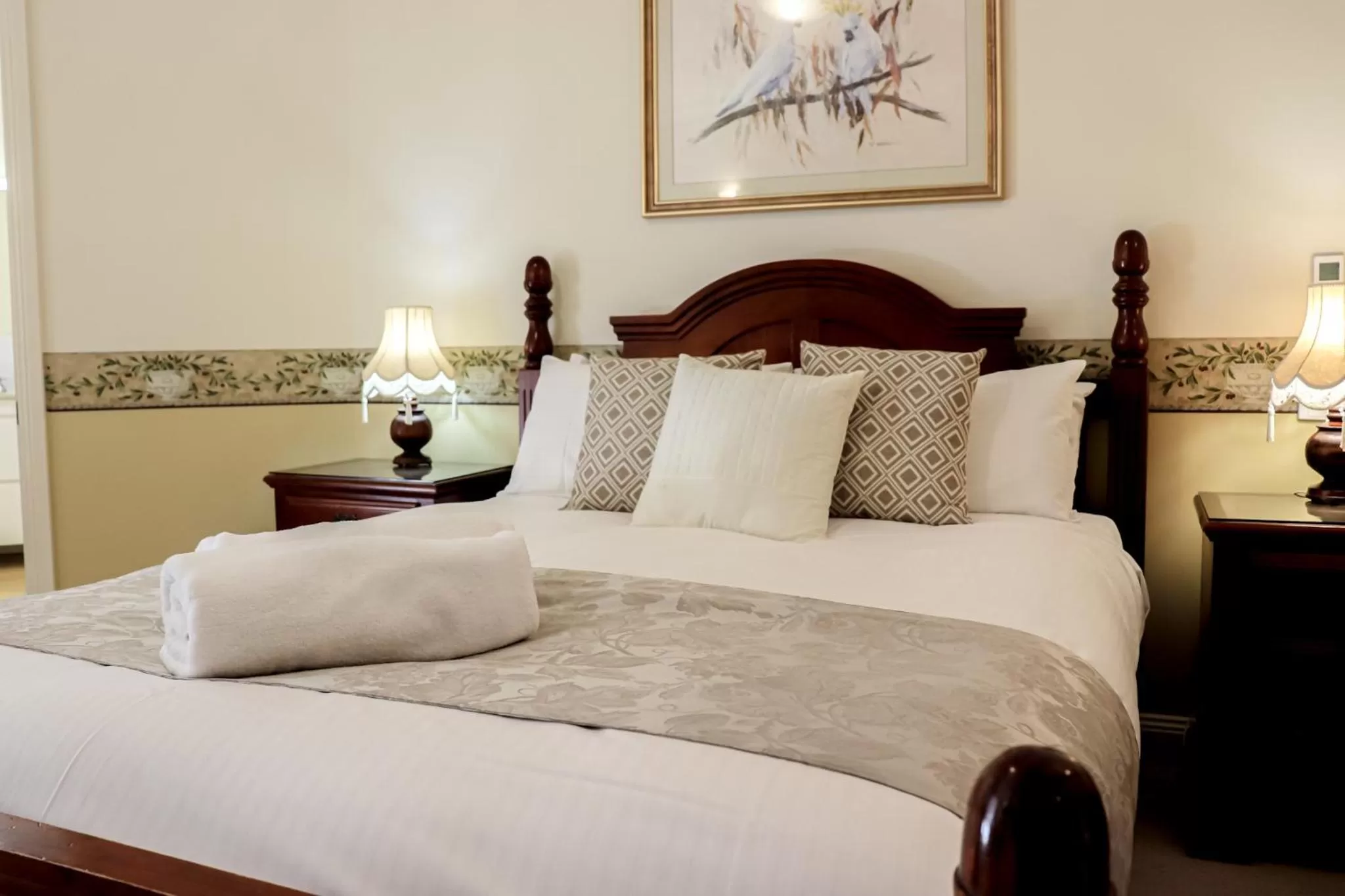 Bed in Plumes Boutique Bed & Breakfast