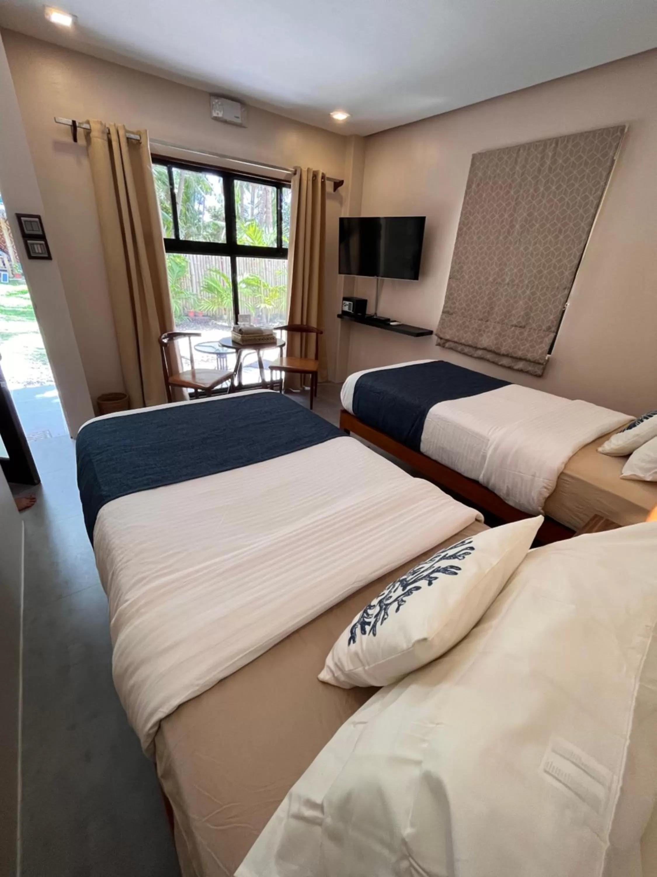 Bed in Southseas Beach Resort and Dive Center