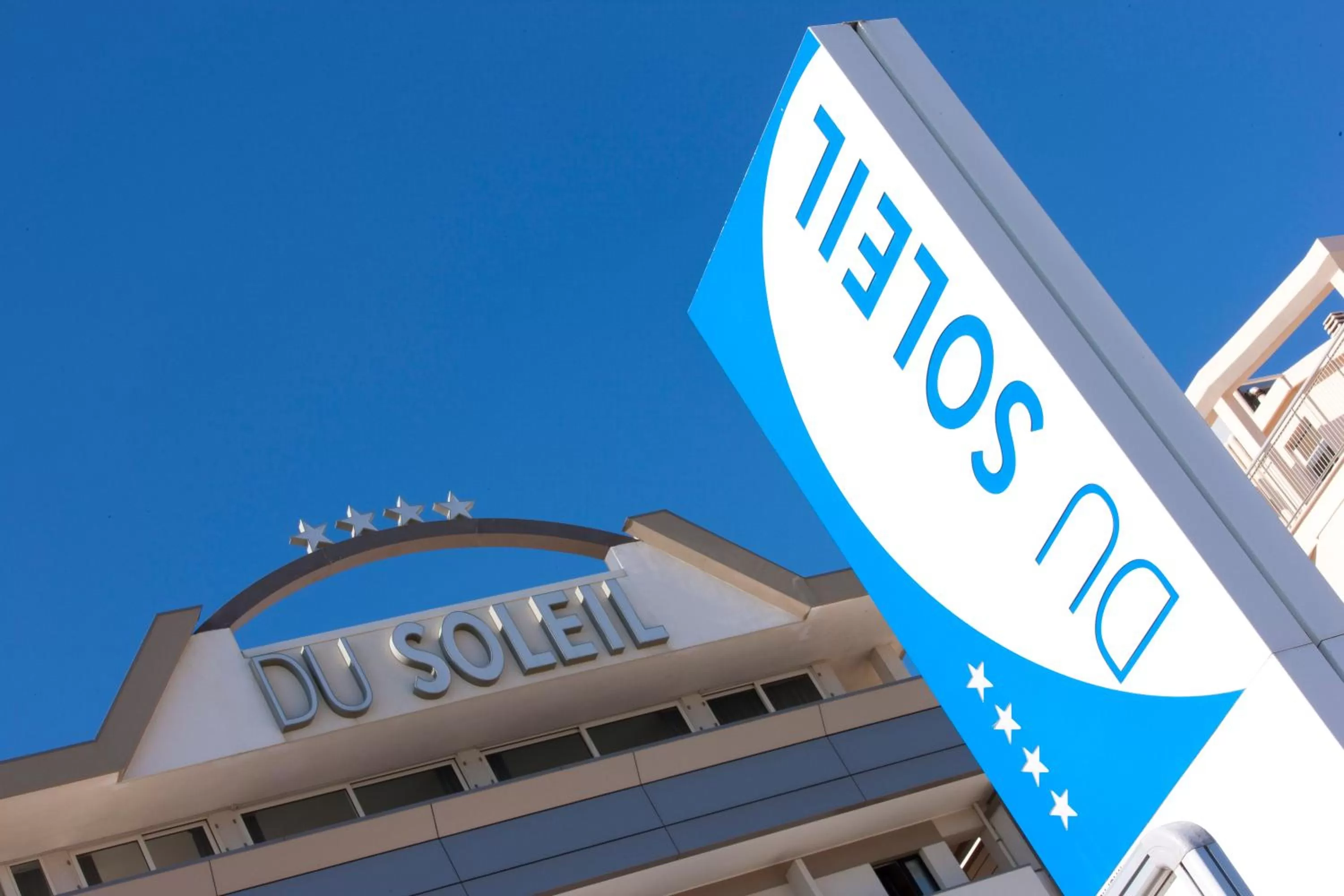 Property logo or sign in Hotel Du Soleil