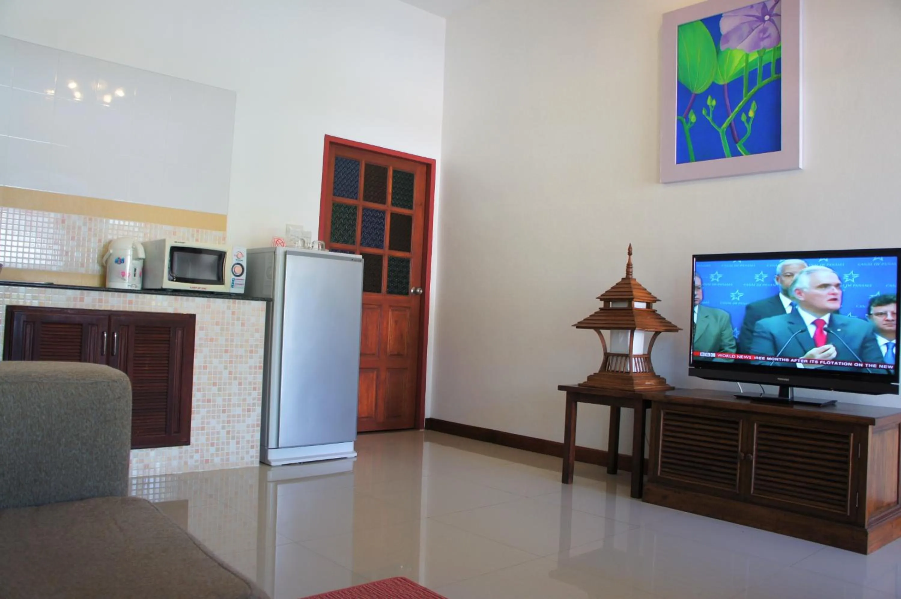 Communal lounge/ TV room in Le Piman Resort