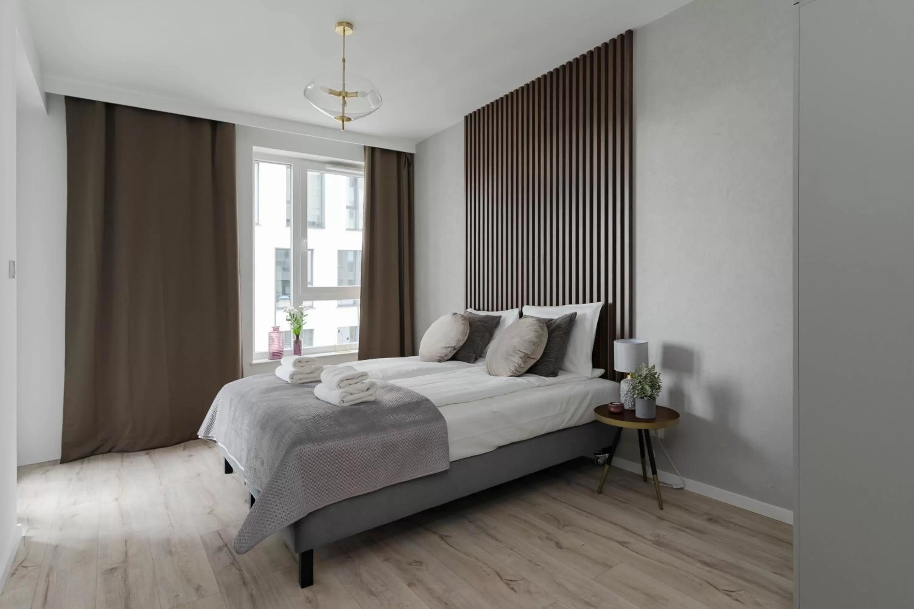 Bed in Symphony Modern Tower Apartamenty