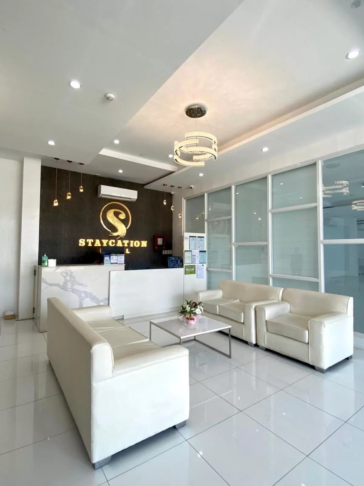 Lobby or reception in Staycation Hotel