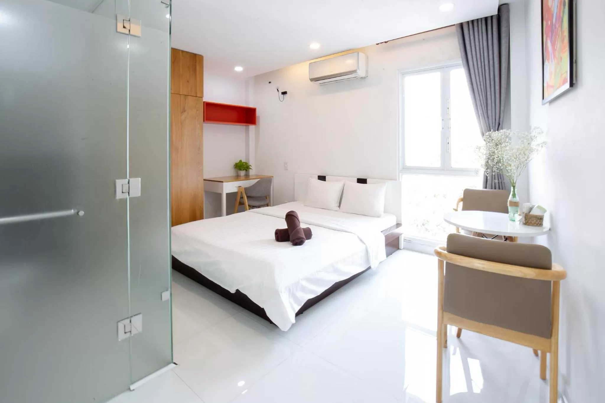 Living room, Bed in HOSTIE SAIGON [WANDERLUST Home]