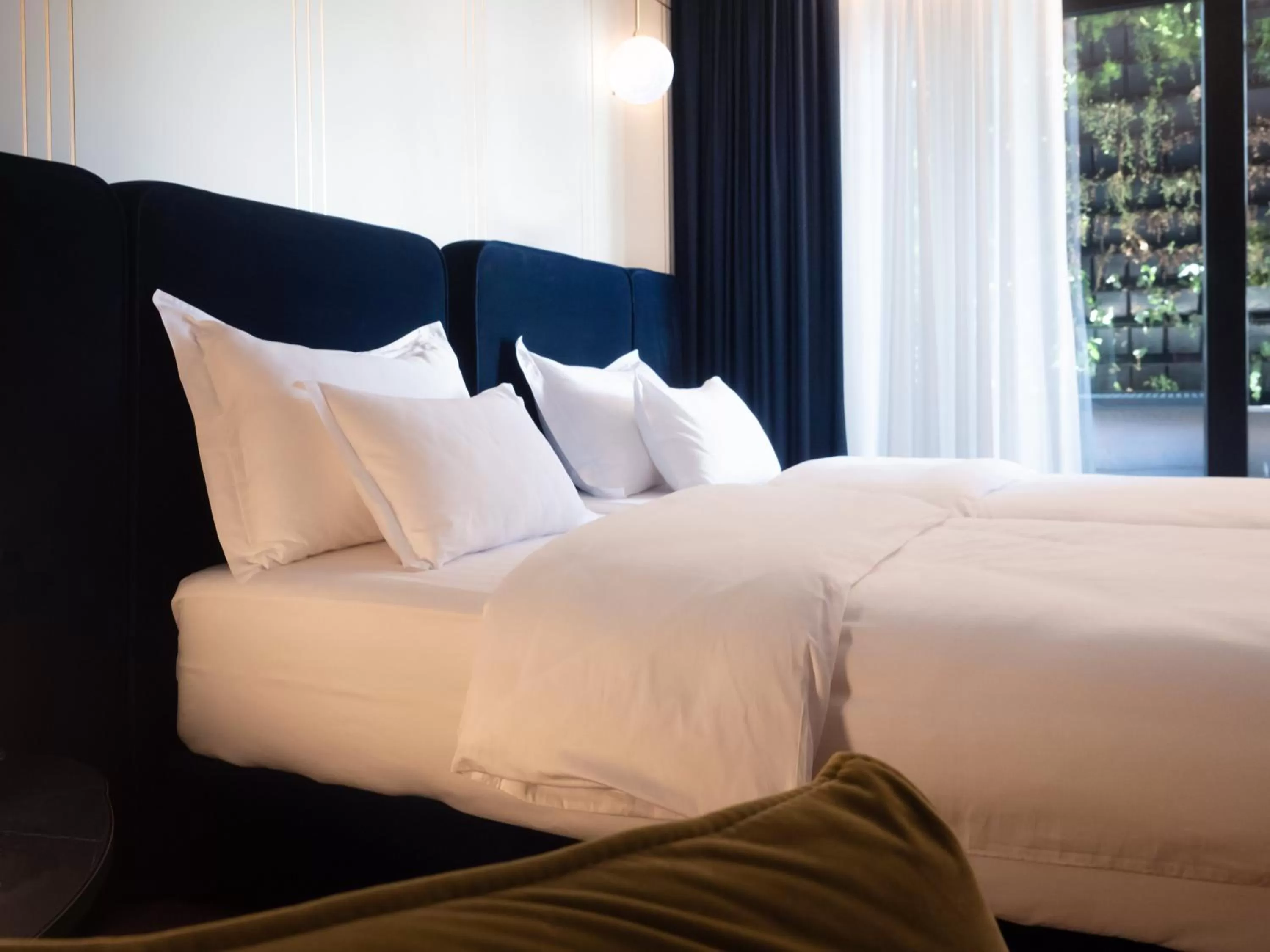 Bed in Moncafe BoutiqueHotel Spa