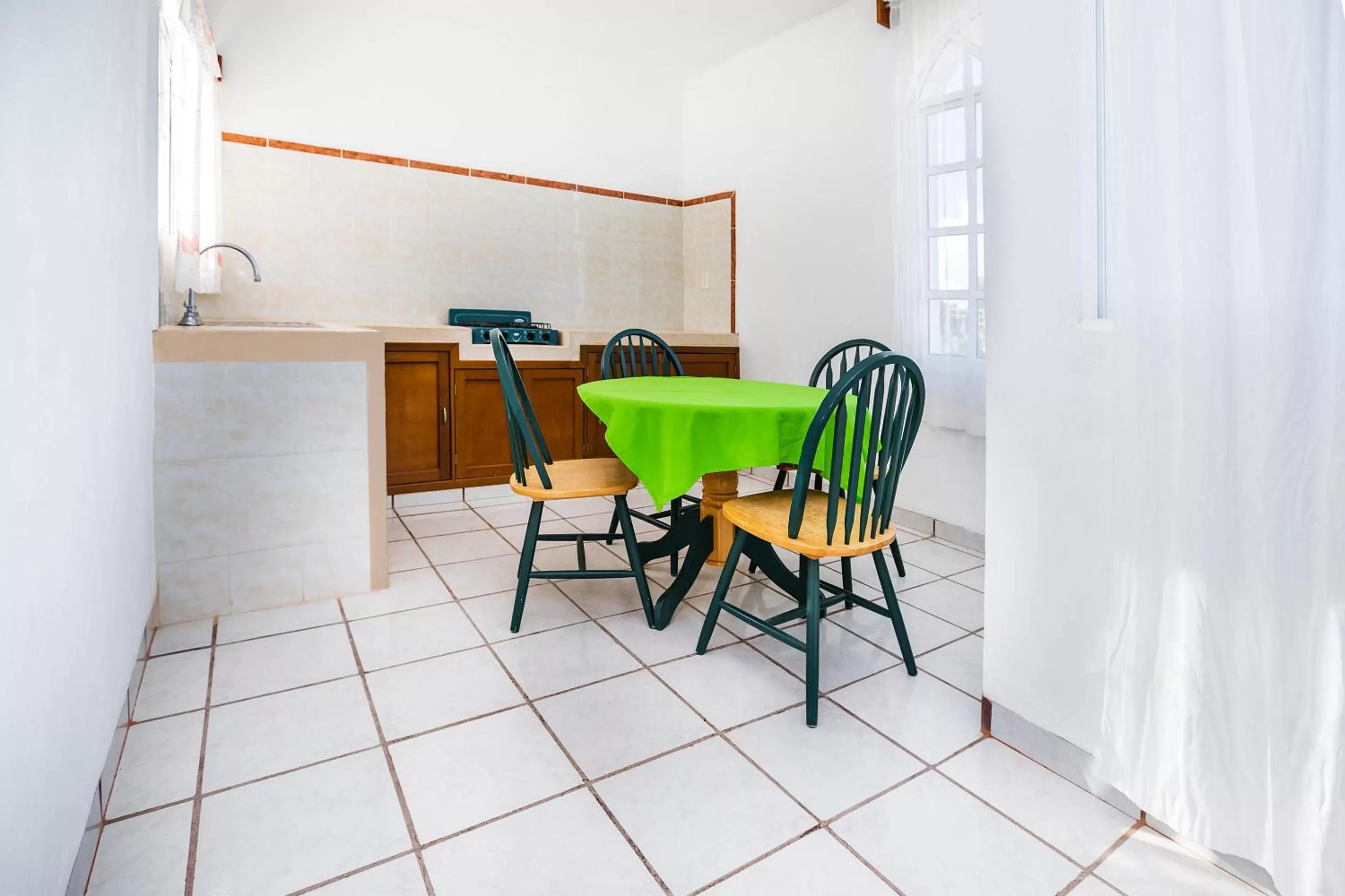 Living room in Capital O Oxtankah,chetumal bay