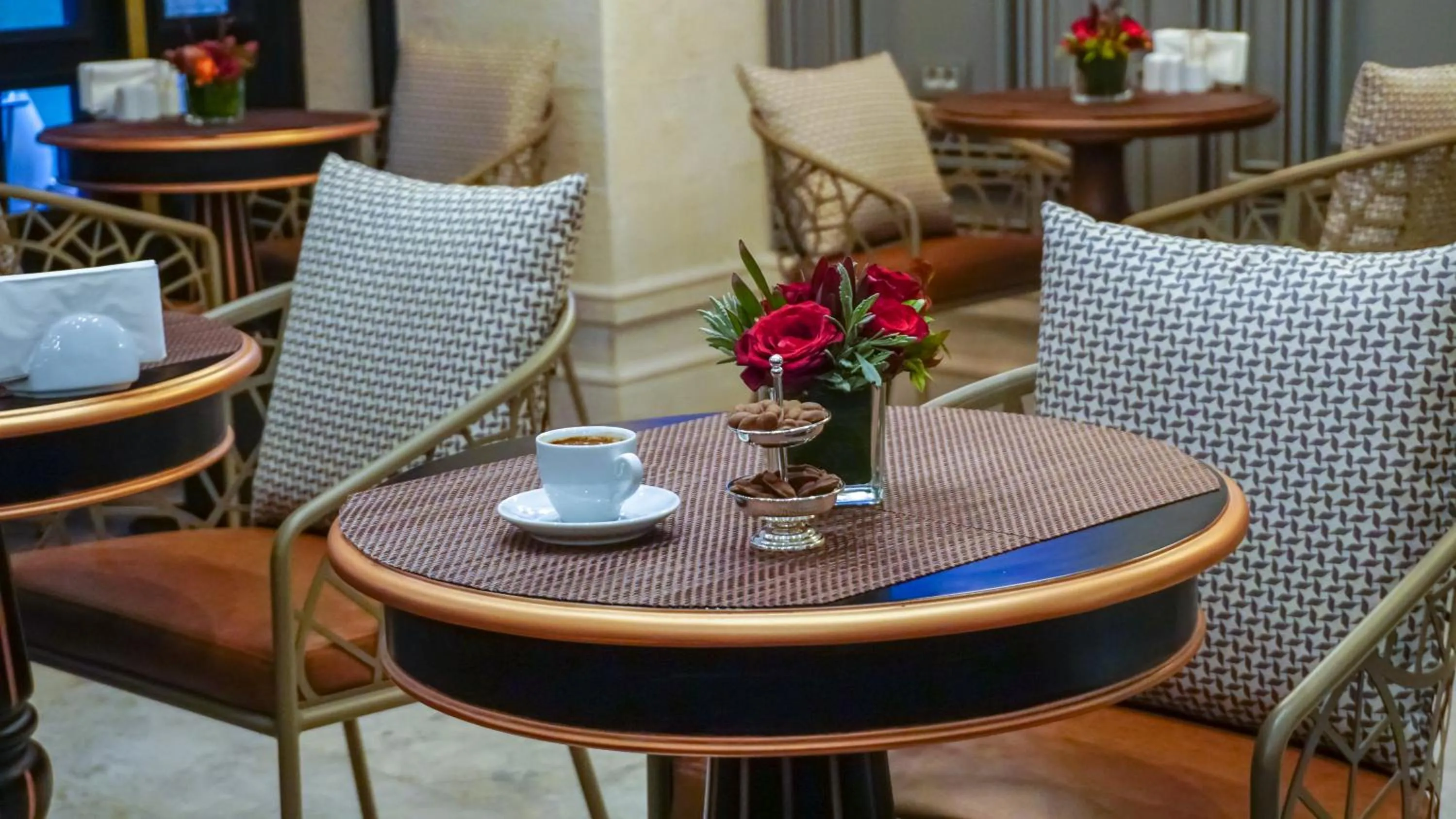 Seating area in Maroon Tomtom