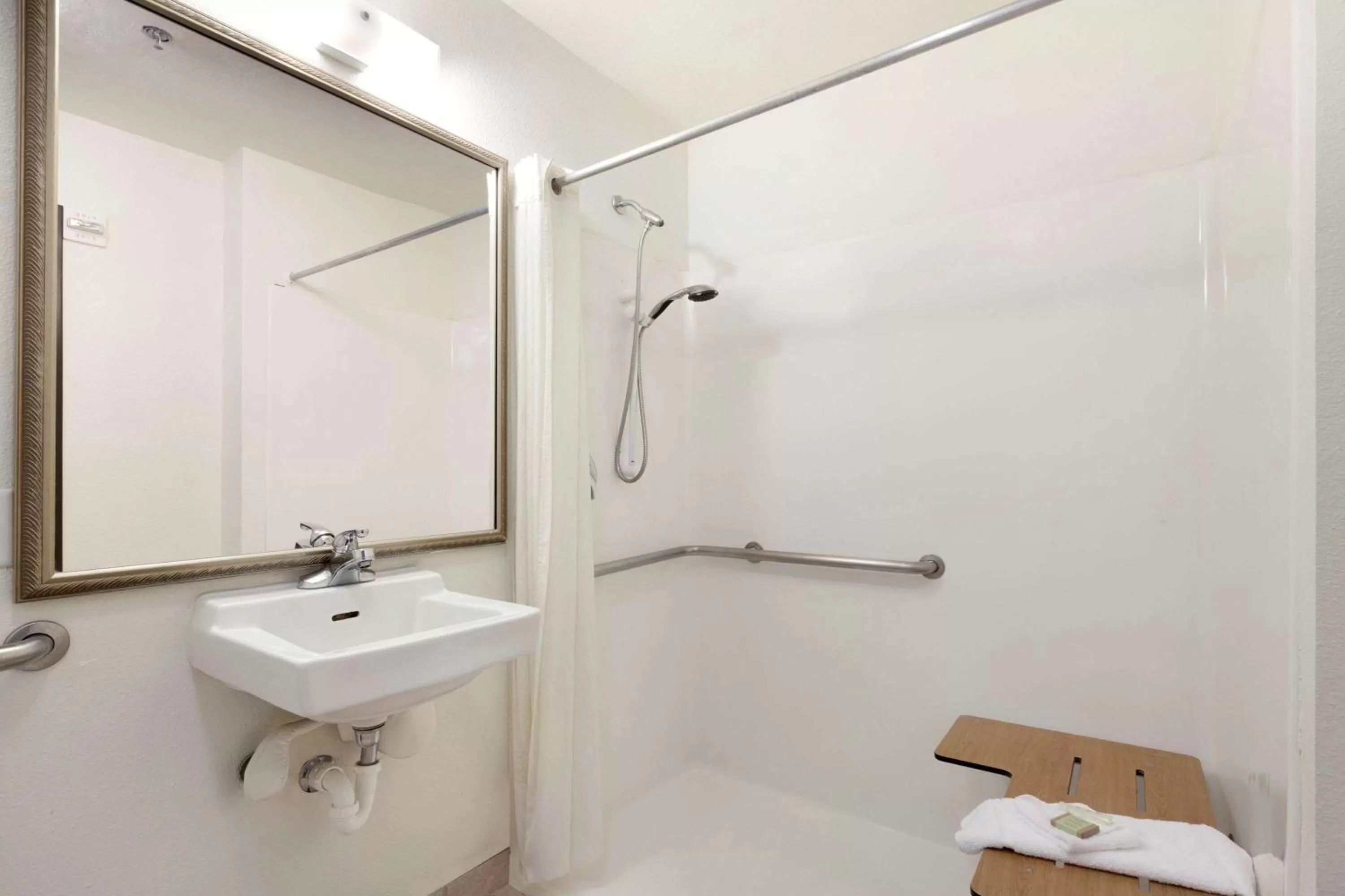 Bathroom in Super 8 by Wyndham Garland Rowlett East Dallas Area