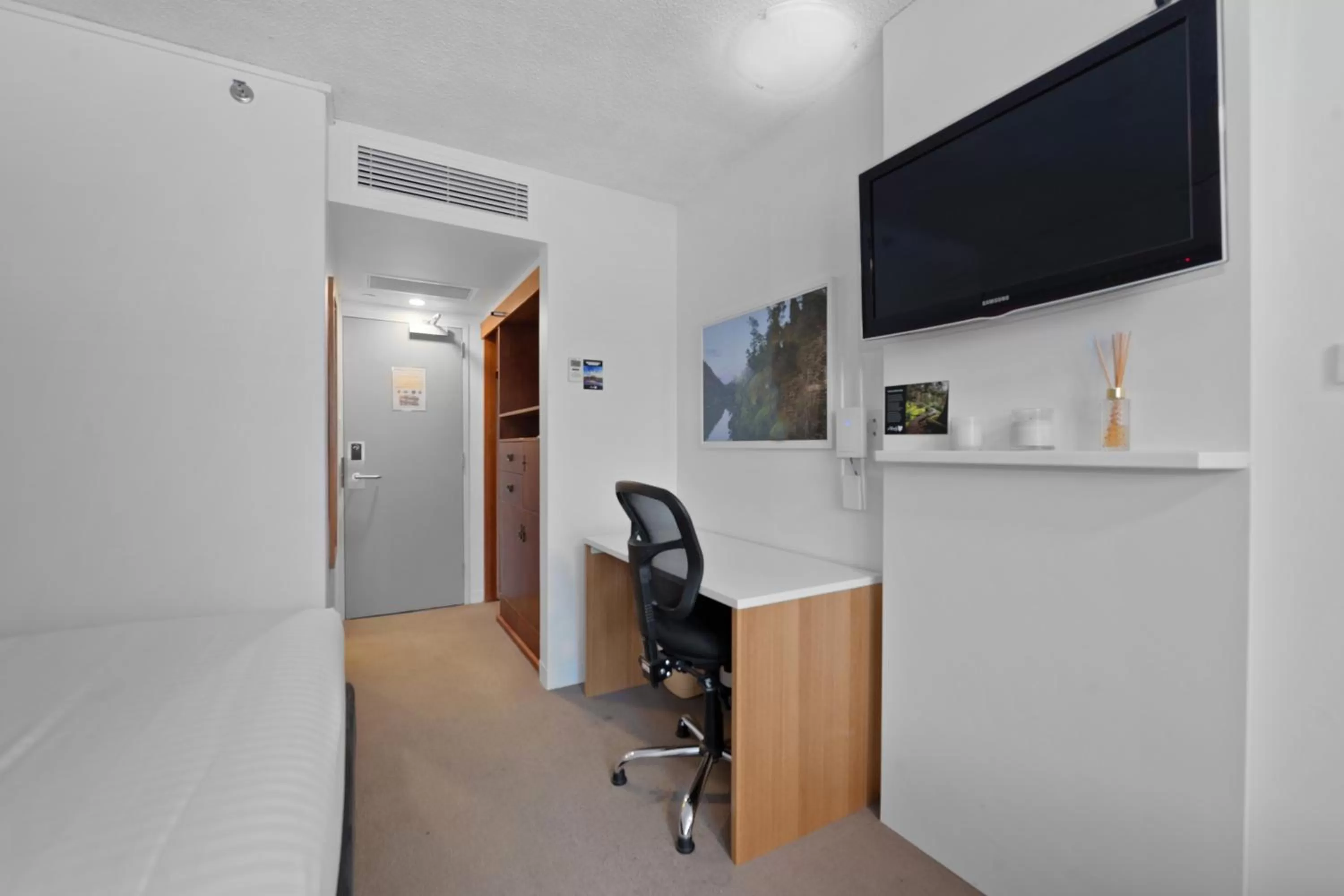 Seating area, Bed in Allurity Hotel