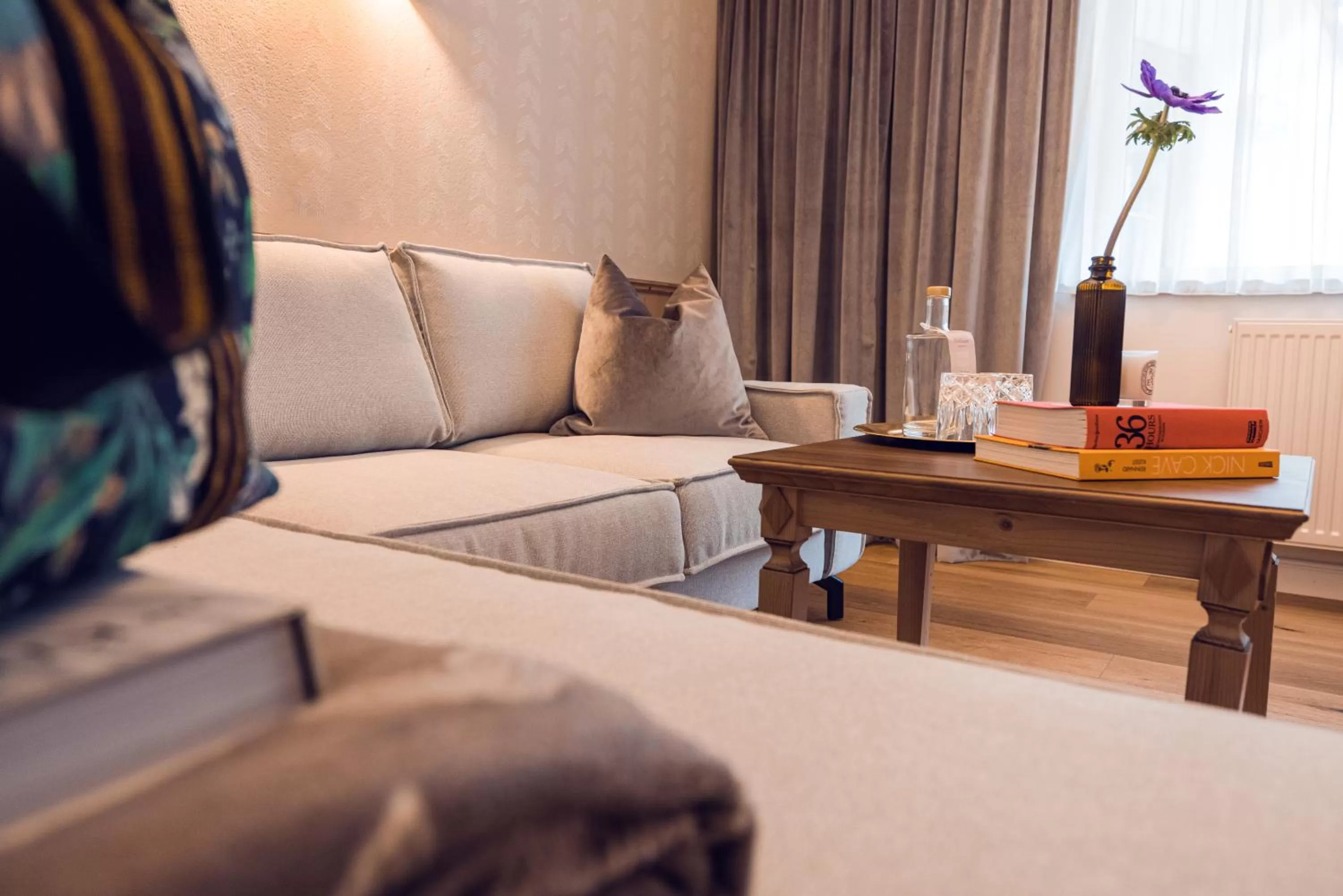 Living room, Bed in Alpine Hideaway ZILLERTALERHOF - 4 Sterne Superior