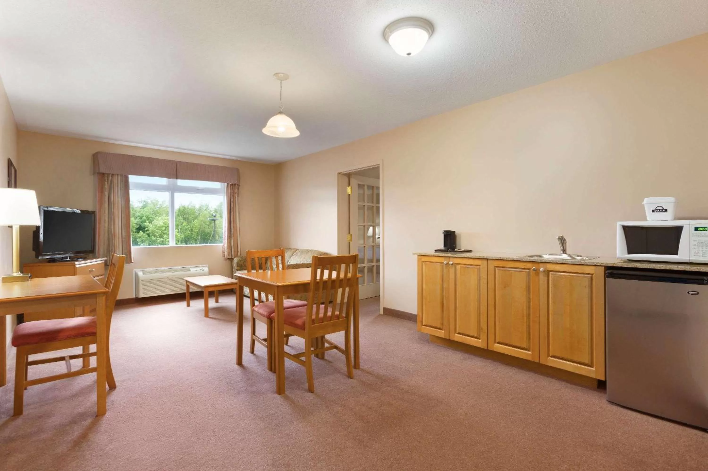 Kitchen or kitchenette in Days Inn by Wyndham Oromocto Conference Centre