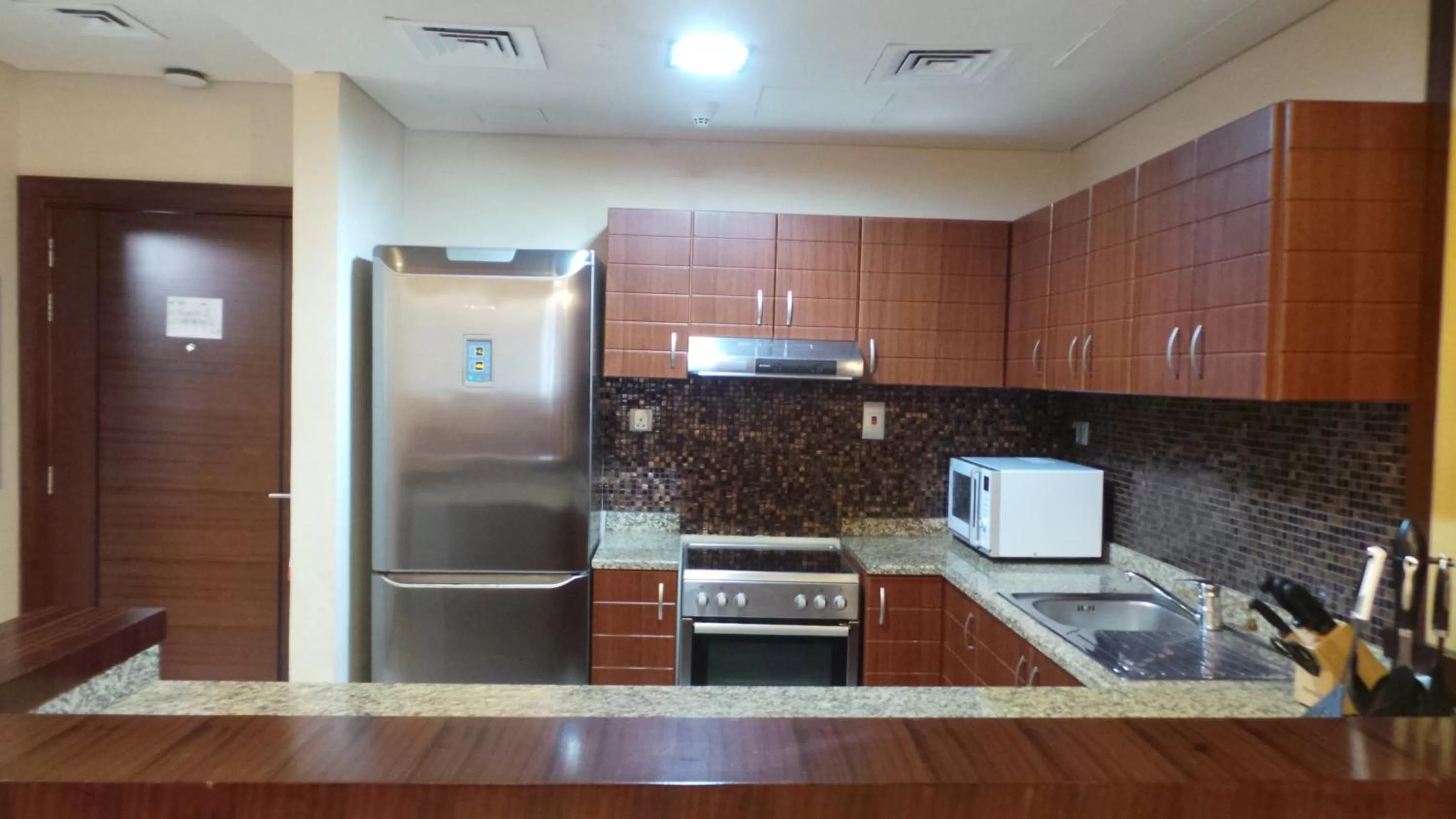 Kitchen or kitchenette in Xclusive Maples Hotel Apartment
