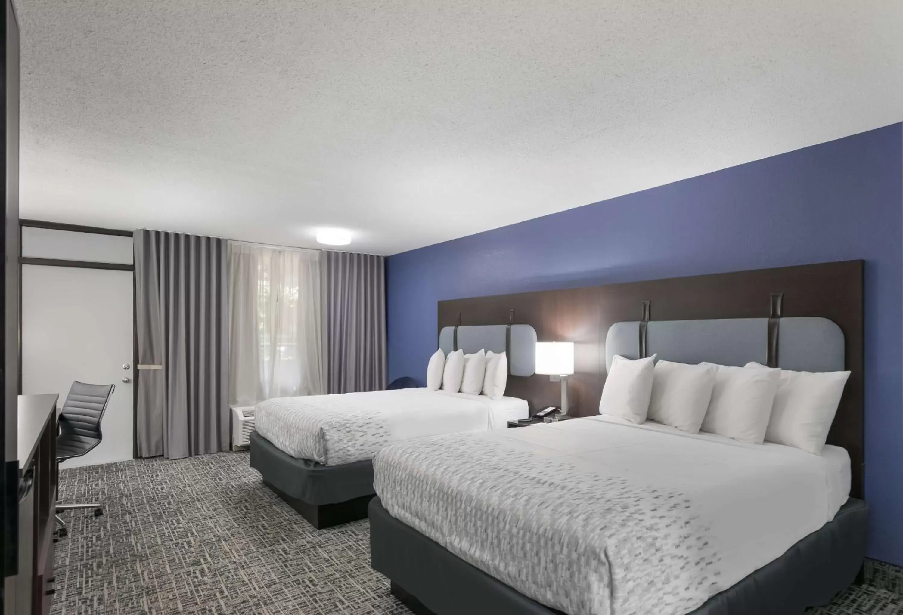 Queen Room with Two Queen Beds with Balcony in SureStay Plus Hotel by Best Western Gatlinburg Queen Room with Two Queen Beds with Balcony in SureStay Plus Hotel by Best Western Gatlinburg